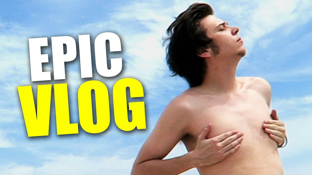 年輕男子喺藍天下雙手放喺心口，有「EPIC VLOG」字樣。