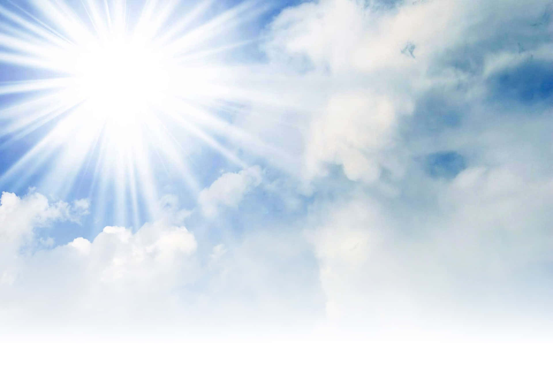太陽在藍天中透過白雲明亮地照耀。