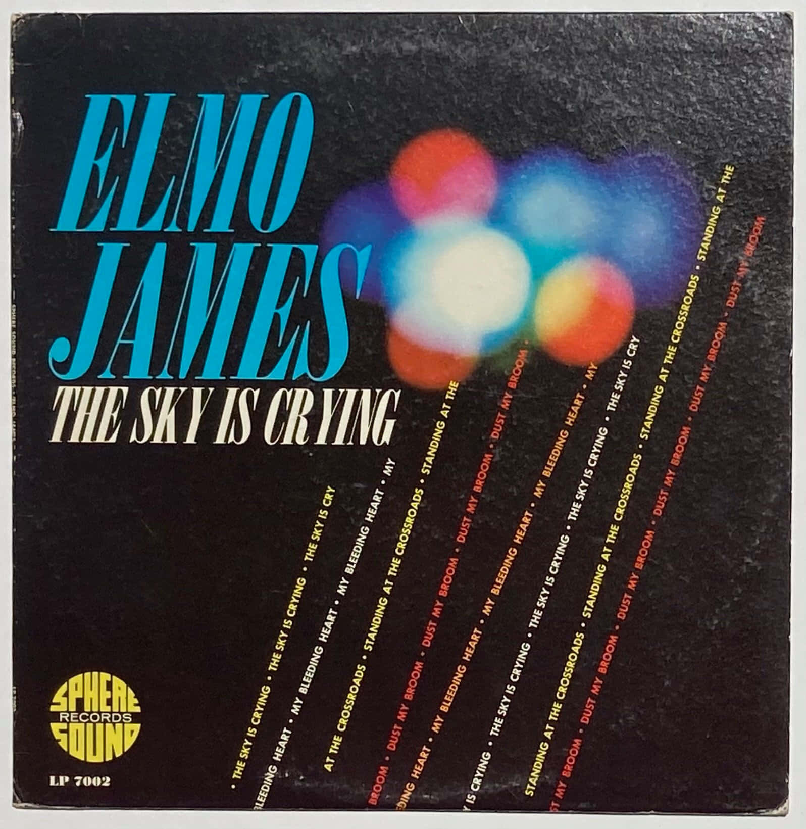 Elmore James《The Sky Is Crying》 壁紙 — Elmo James 的復古專輯封面，採用粗體藍色字體和彩色散景燈光，背景為黑色。