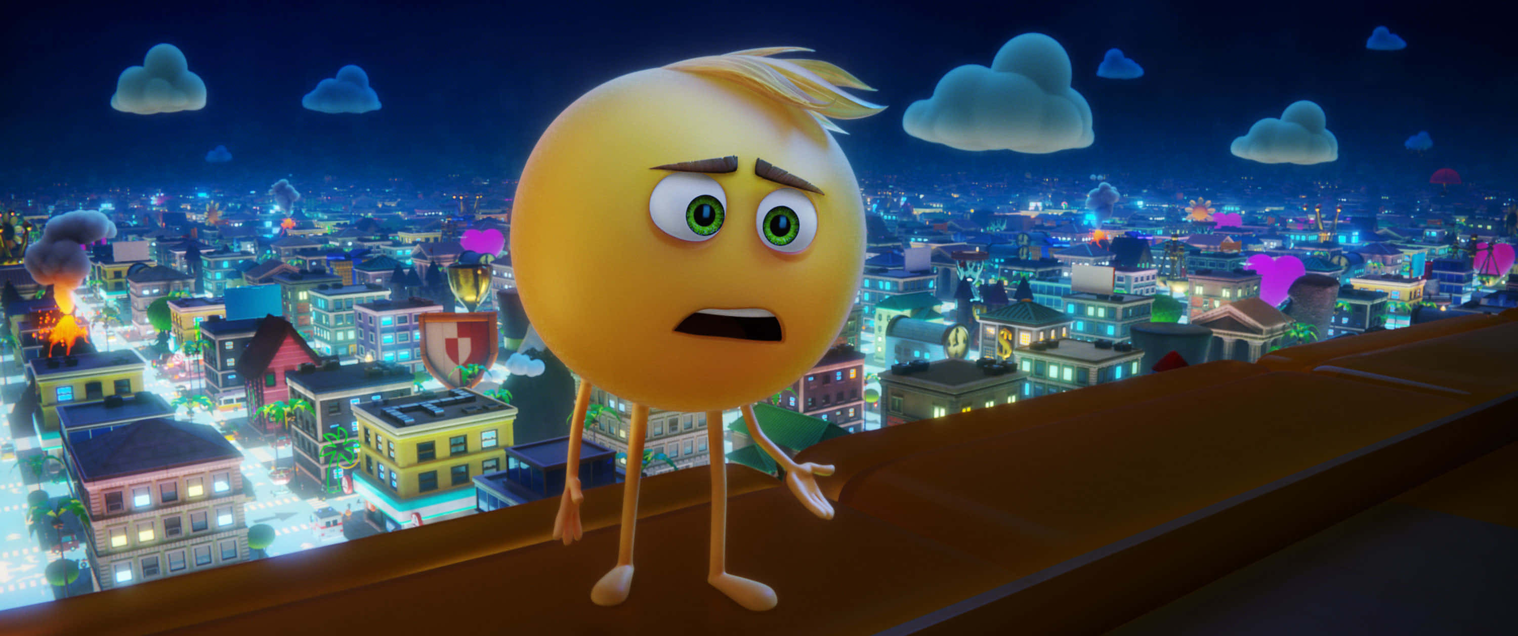 《Emoji 大電影》Gene Meh 場景 壁紙 — 一個憂慮的黃色表情符號站在屋頂上，俯瞰著充滿發光建築和浮雲的充滿活力的夜景城市景觀。
