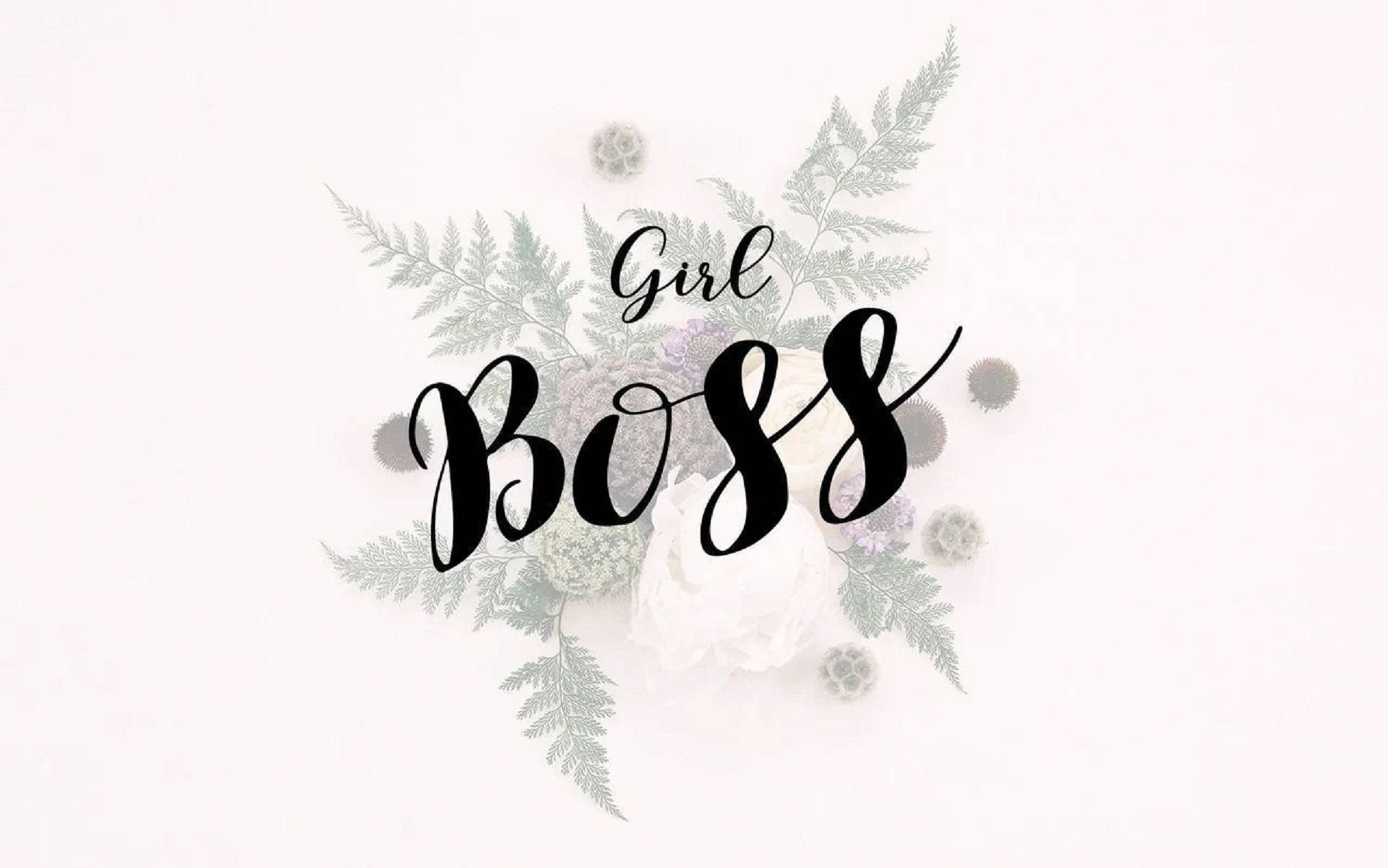 優雅的花卉佈置，白色背景上以黑色字體寫有「Girl Boss」文字。