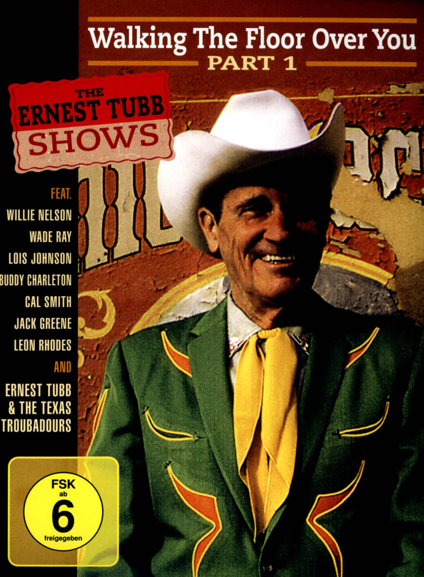 Ernest Tubb 戴著牛仔帽、穿著綠色西裝在專輯封面上微笑。