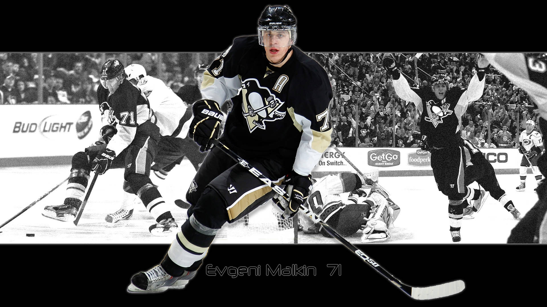 冰球運動員 Evgeni Malkin 在比賽中慶祝入球。