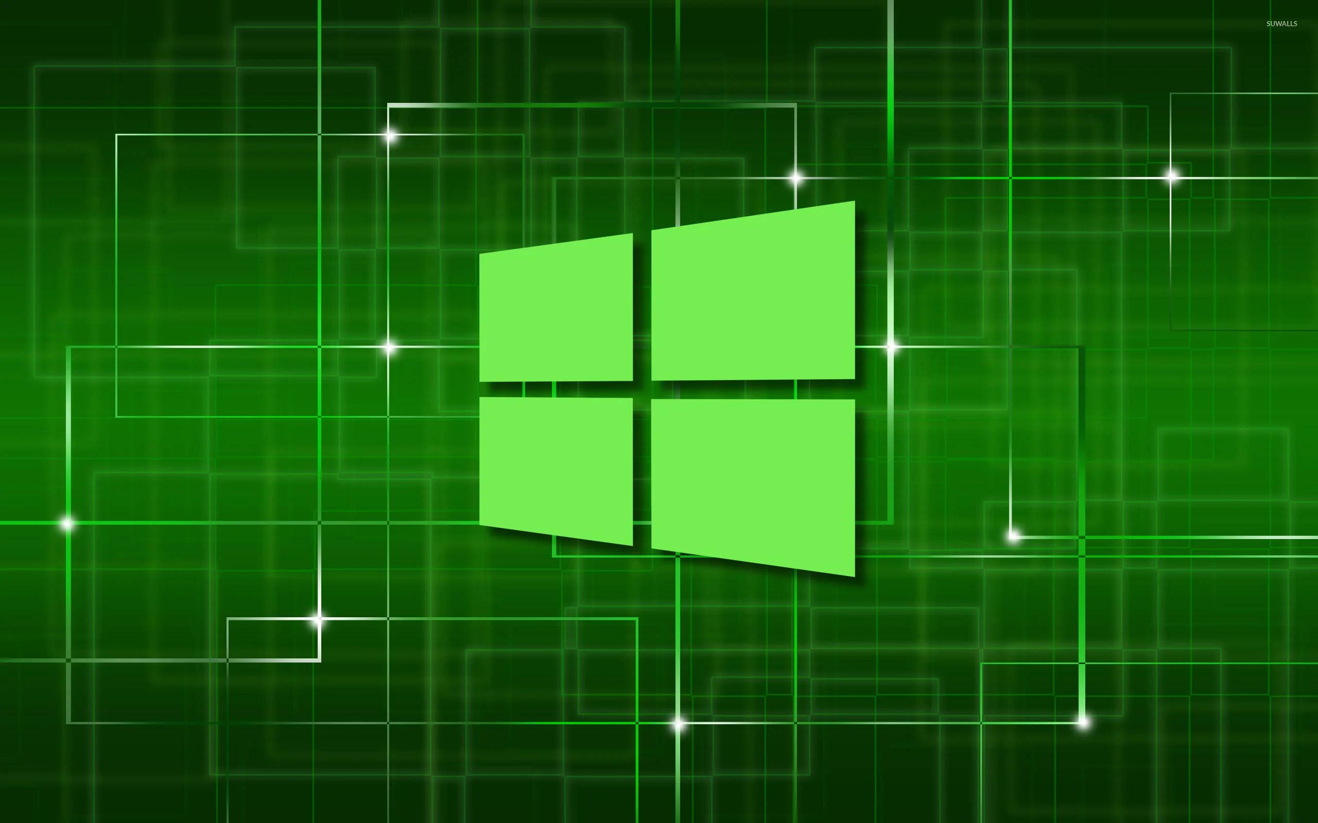 Excel Microsoft Windows綠色標誌 壁紙 — 一個發光的綠色Windows標誌，居中在一個帶有明亮星形高光的數字網格上，背景為深綠色。