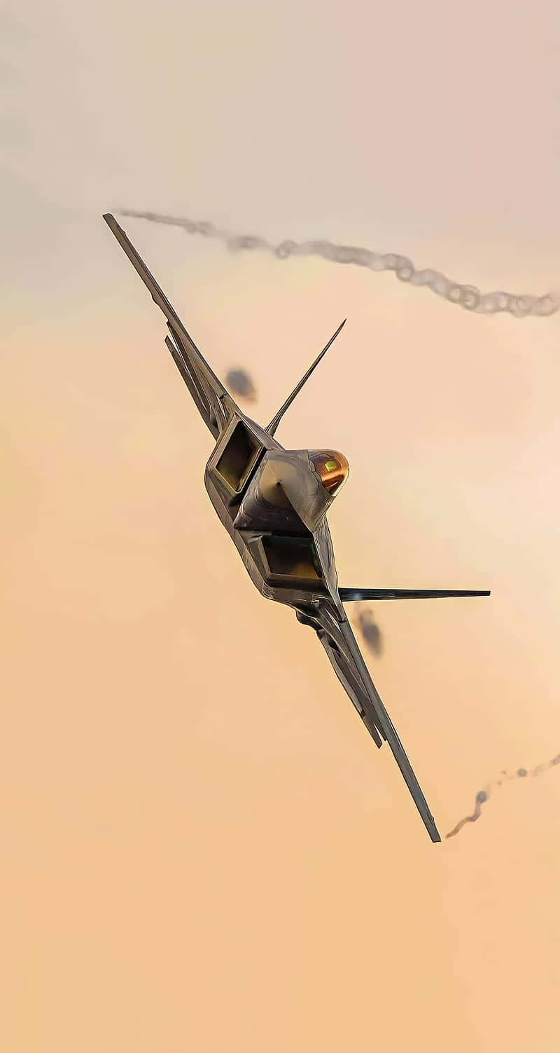 隱形戰機在橙色天空中飛行，帶有煙跡