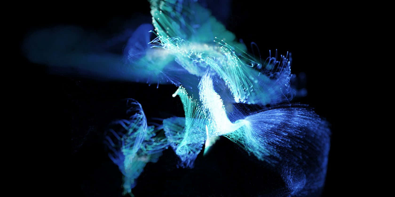  壁紙 — 發光的藍色和綠色水母狀生物在漆黑的背景下優雅地漂浮。