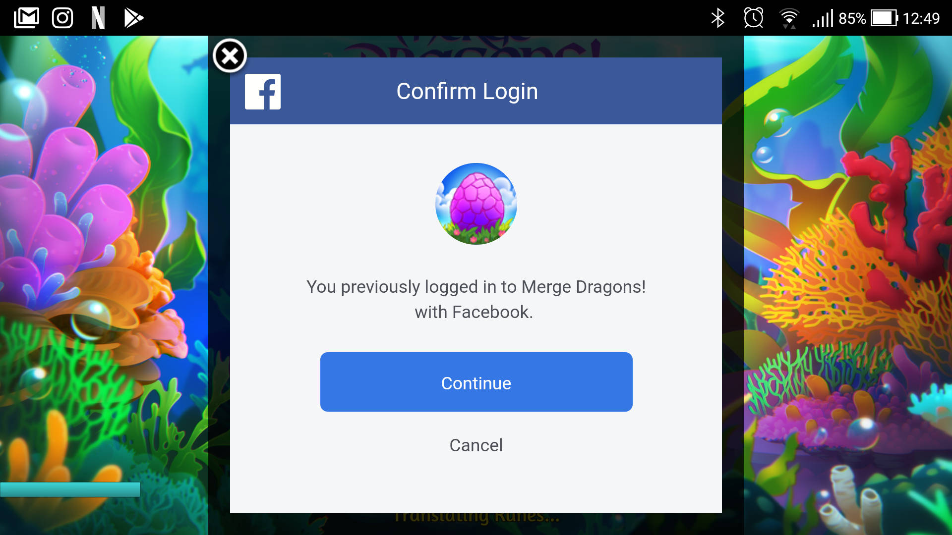 Merge Dragons! 遊戲登入畫面，帶有水下珊瑚背景。