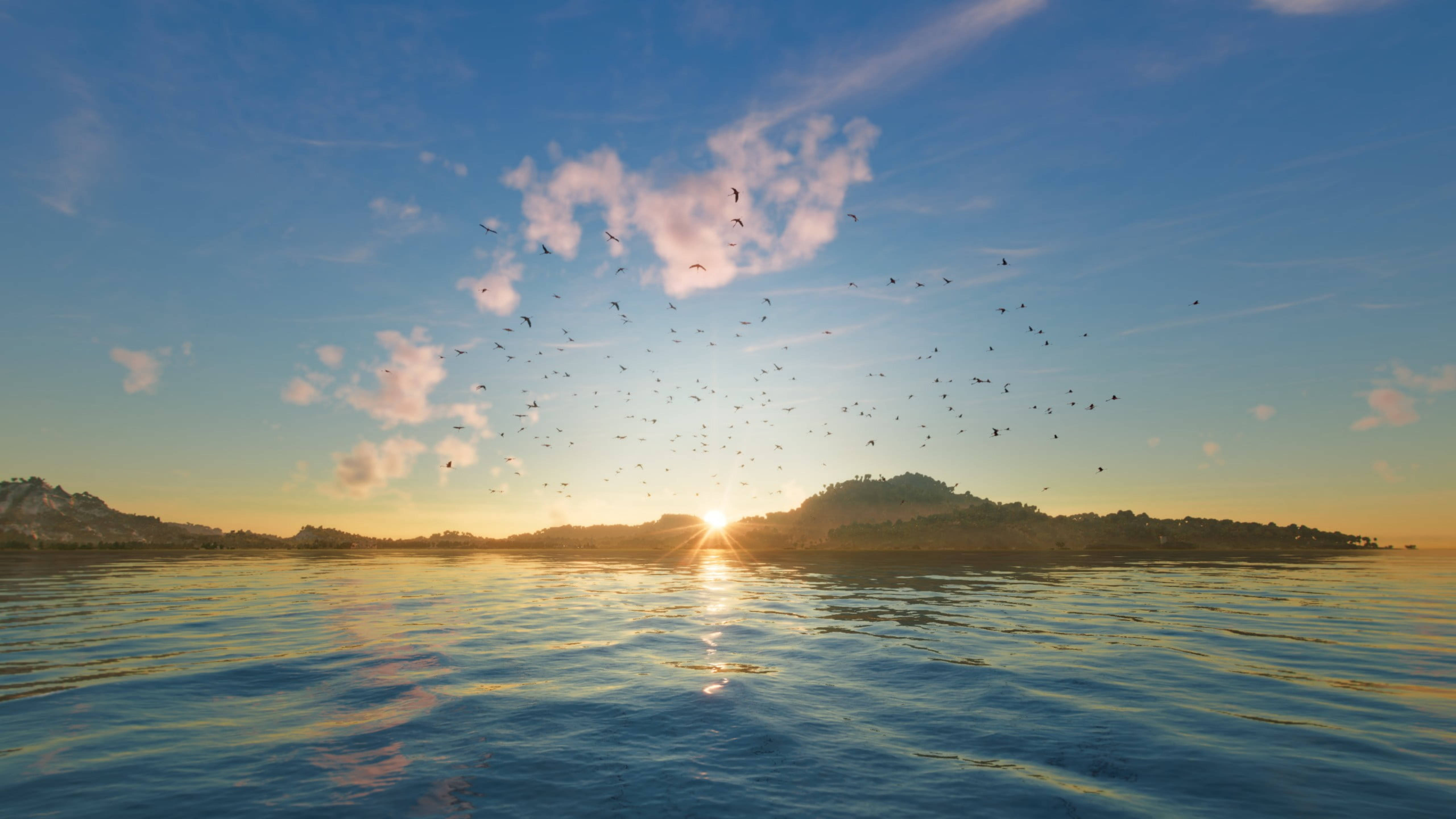 Far Cry 6 海洋日落 壁紙 — 平靜海洋上的日落，鳥兒在柔和藍天下飛越剪影般的島嶼。