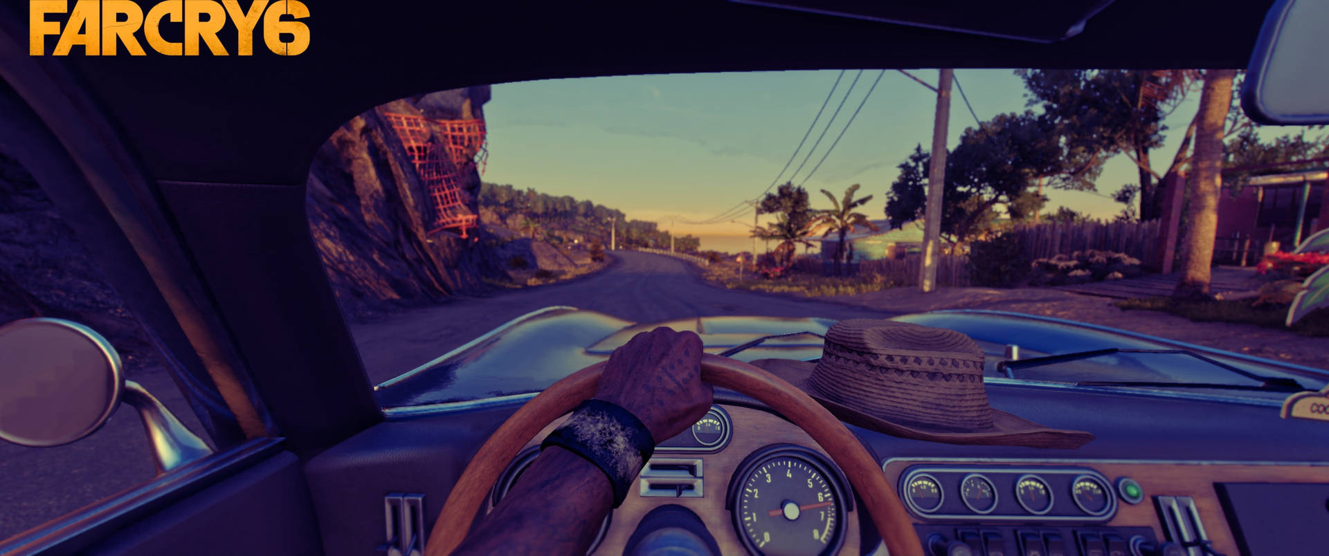 玩家在《Far Cry 6》中駕駛經典車穿越熱帶日落。