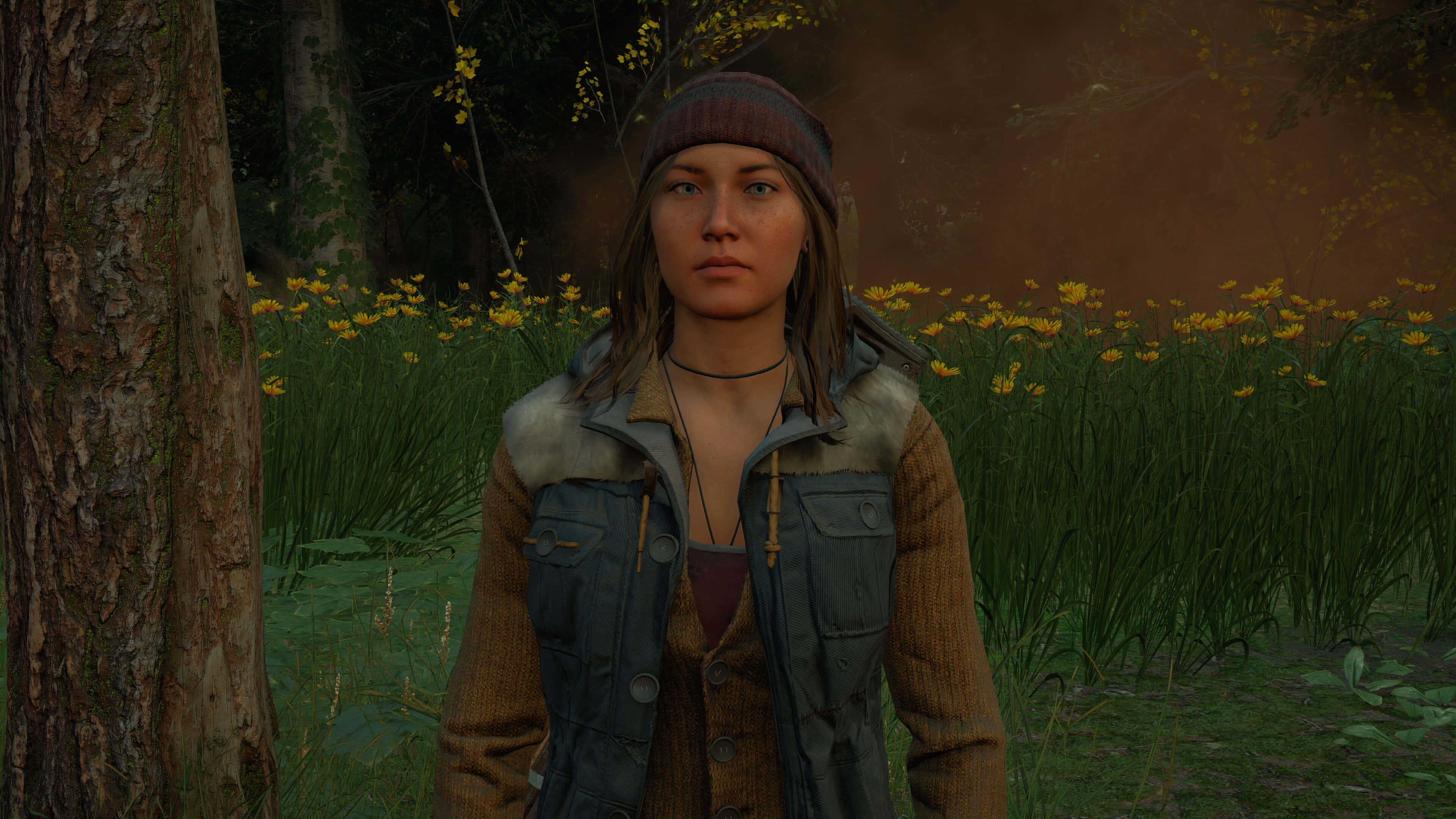 《Far Cry New Dawn》1440p 高清遊戲背景 壁紙 — 一位戴著冷帽和背心的年輕女子，在長滿黃花和苔蘚樹木的森林中莊嚴地站立。