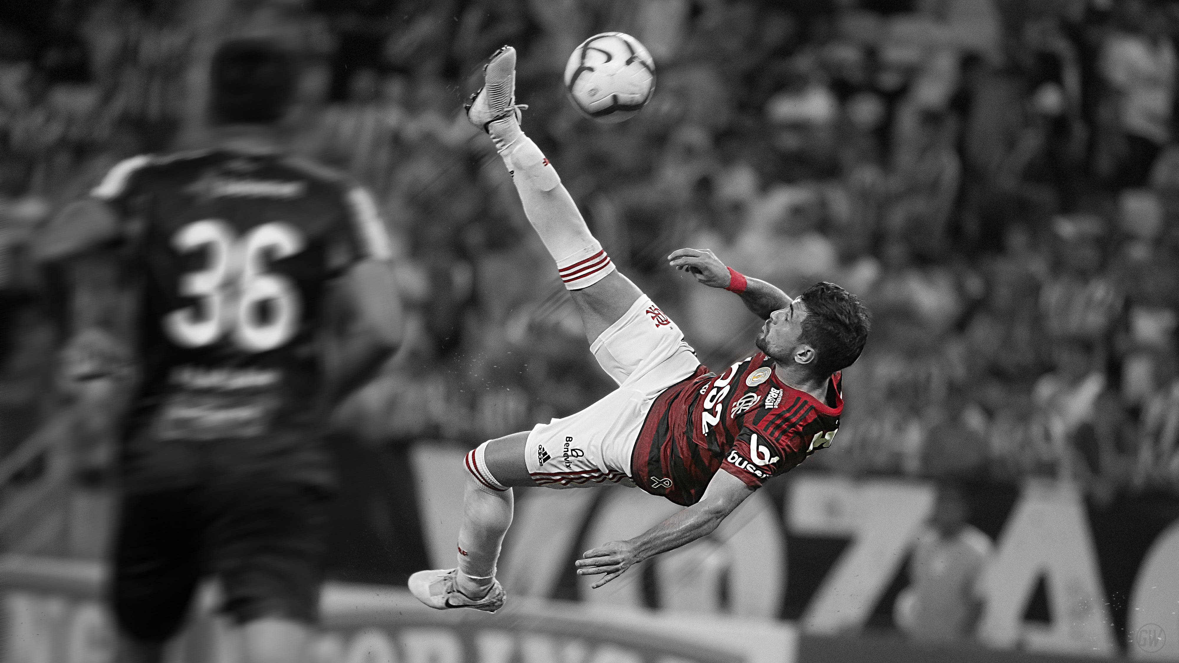 弗拉門戈FC 阿拉斯卡塔 壁紙 — 一名足球員在半空中做出戲劇性的倒掛金鉤，背景是黑白球場場景。