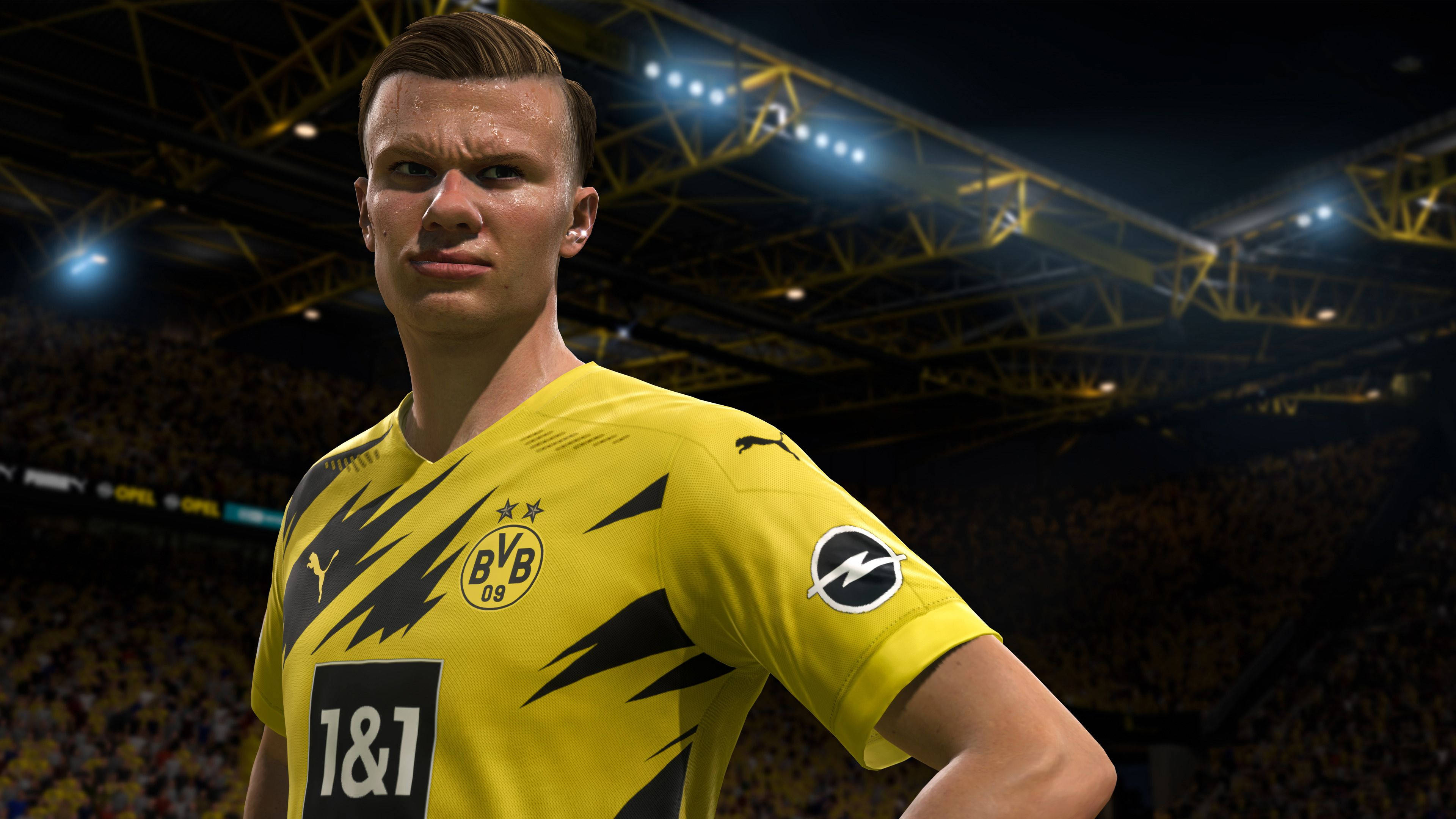 FIFA 21挪威足球員埃爾林·哈蘭德 壁紙 — 一個數位渲染的足球員艾寧·夏蘭特，身穿黃色多蒙特球衣，站在擠滿觀眾的球場上，在明亮的泛光燈下。