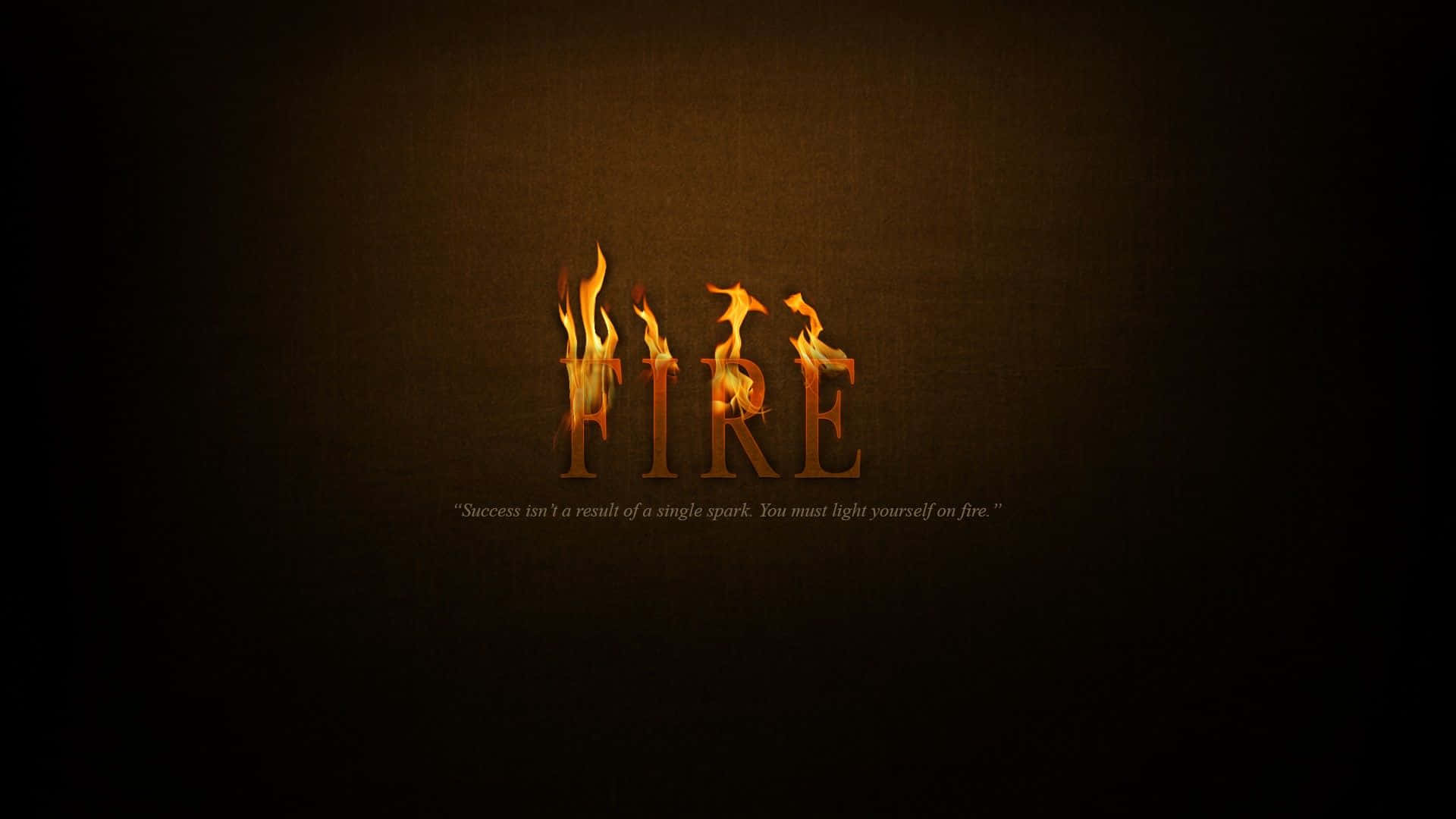 Success 桌布 壁紙 — 「FIRE」一詞在深色紋理背景上以動畫火焰燃燒，下方附有勵志語錄。