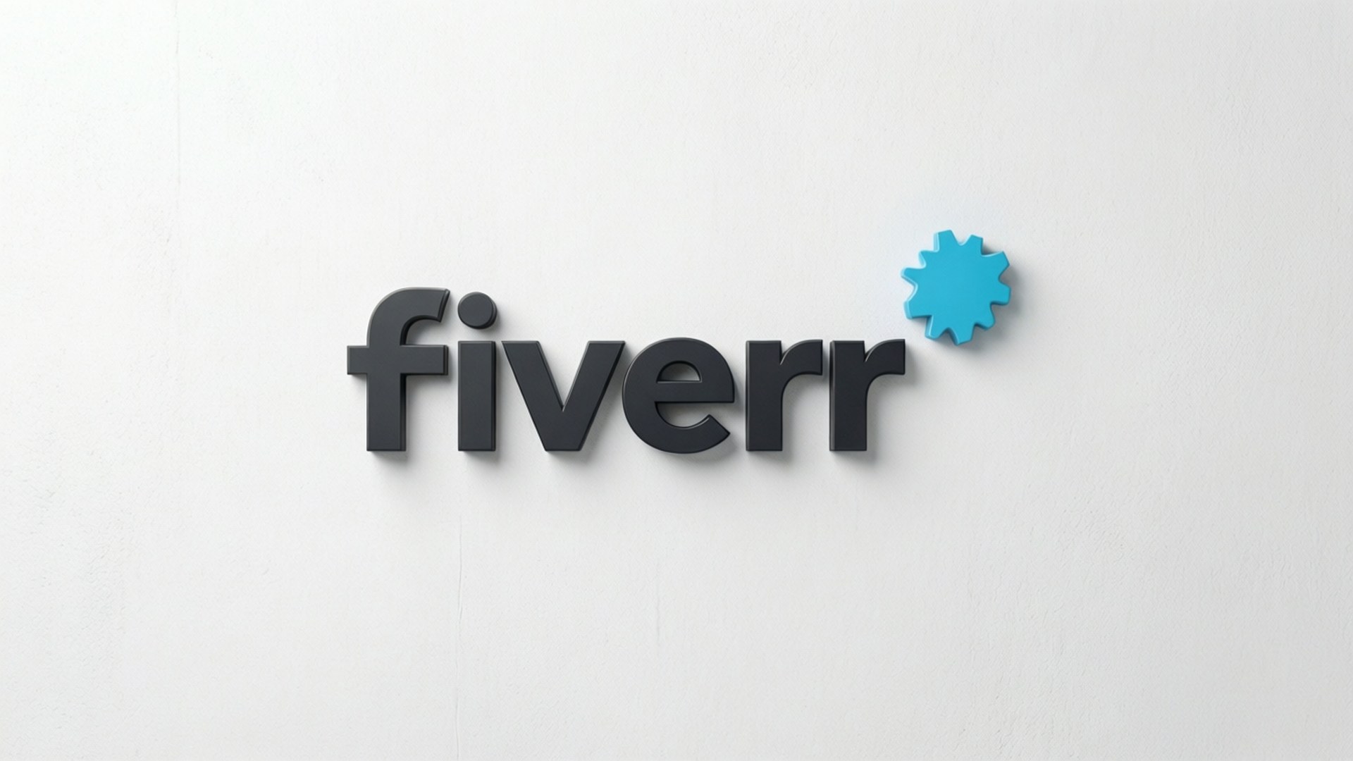 Fiverr 桌布 壁紙 — Fiverr 標誌以深灰色 3D 字體呈現，帶有藍色齒輪圖標，安裝在純白色牆壁上。
