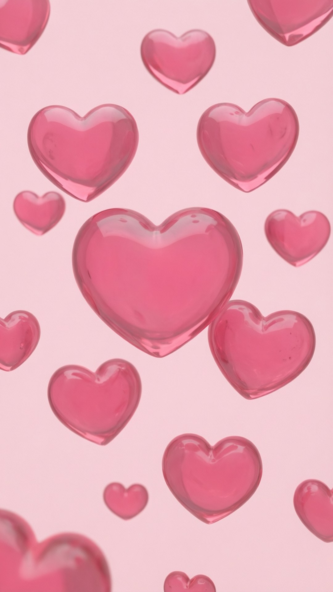 Floating Pink Hearts 壁紙 — 不同大小的光澤粉紅色心形漂浮在柔和的粉紅色背景上。