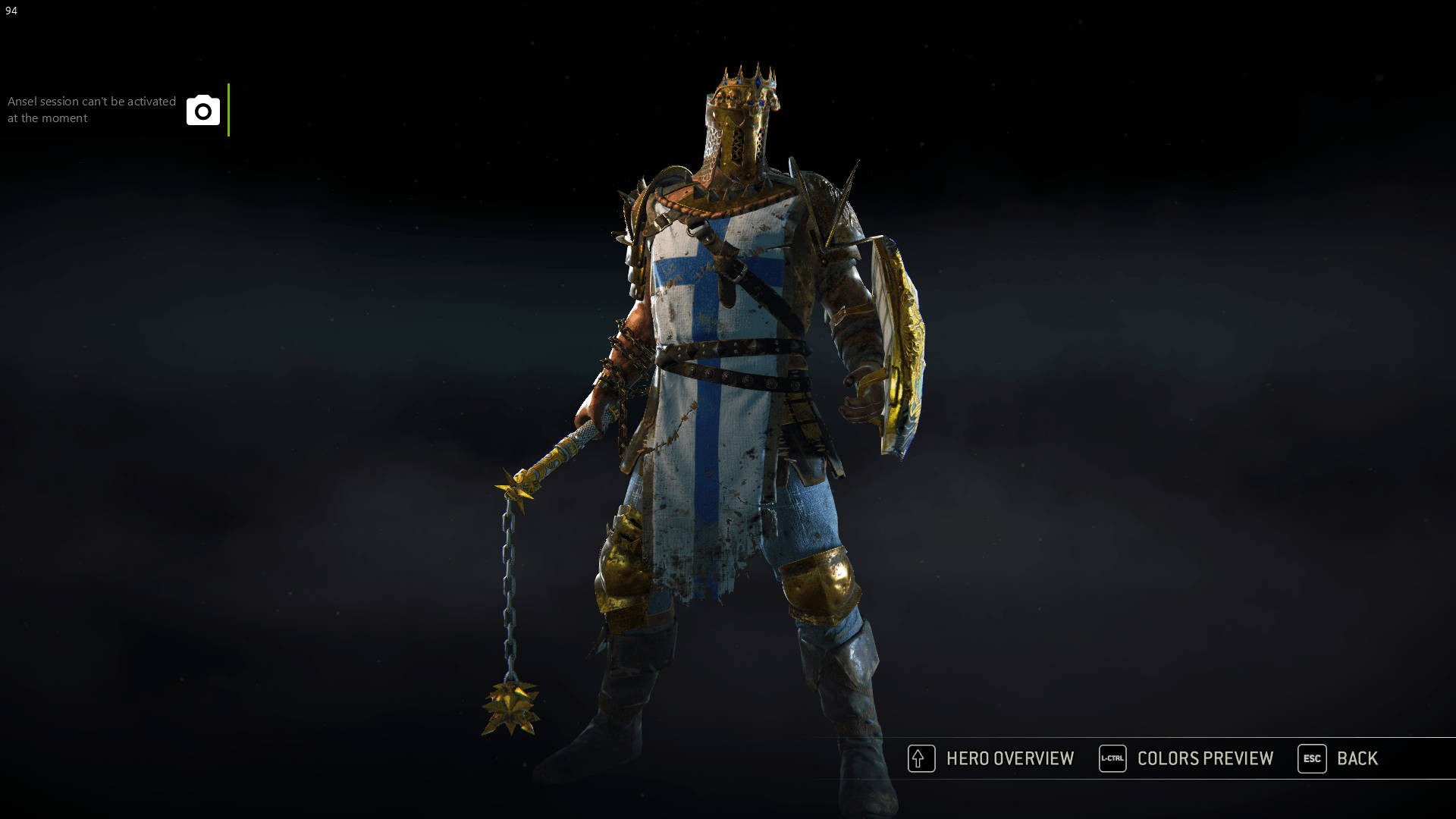《For Honor》征服者騎士皮膚 壁紙 — 一位身穿華麗藍金盔甲的騎士，在黑暗迷霧的背景中手持狼牙棒。