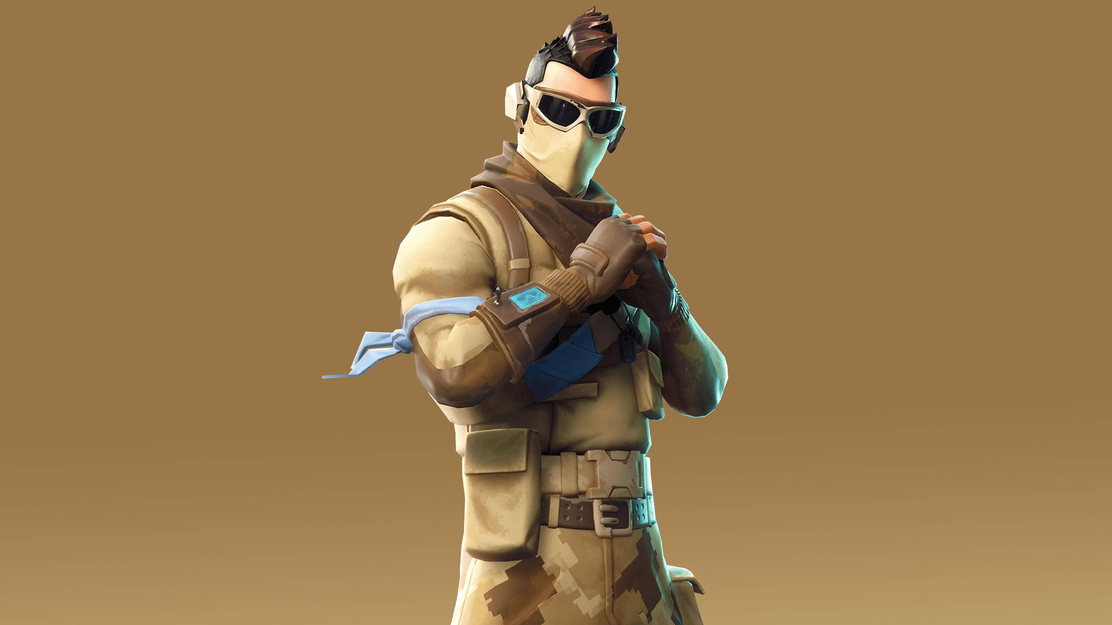 《Fortnite》犰狳皮膚 壁紙 — 一個穿著沙漠裝備的Fortnite角色自信地站在純棕色背景前。