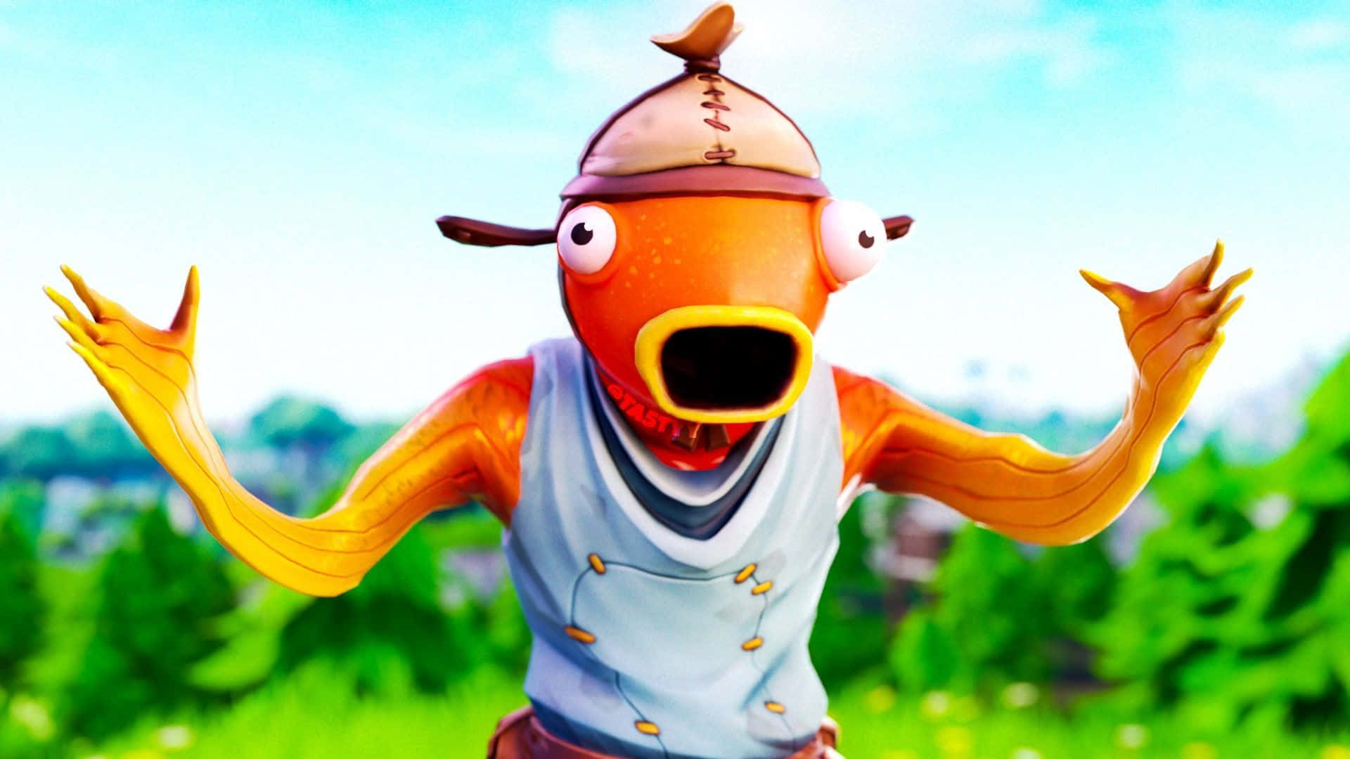Fortnite 魚棒驚訝表情 壁紙 — 一個卡通橙色魚角色，戴著廚師帽和背心，在明亮的藍天下，於充滿活力的綠色田野中張開雙臂站立。