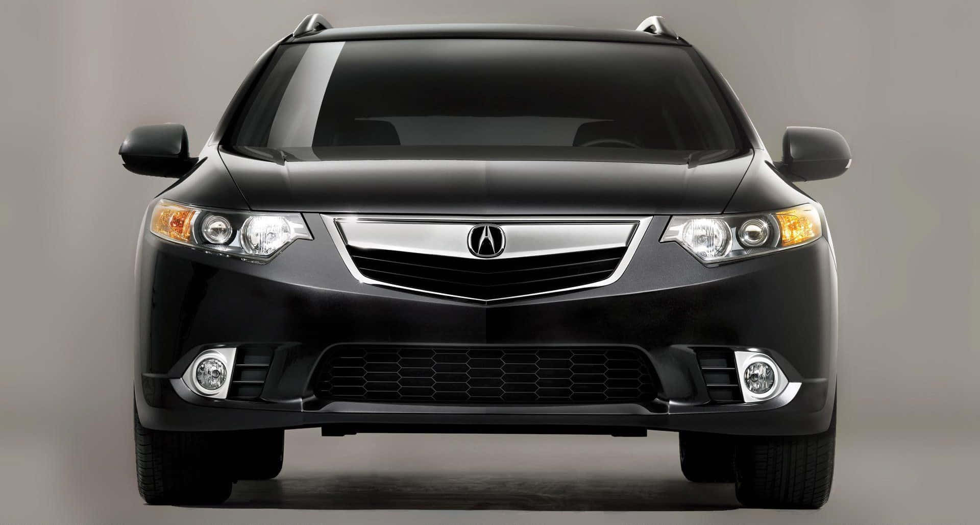 Acura Tsx 桌布 壁紙 — 黑色Acura MDX SUV的正面視圖，帶有鍍鉻飾條和鋒利頭燈，背景為中性灰色工作室。