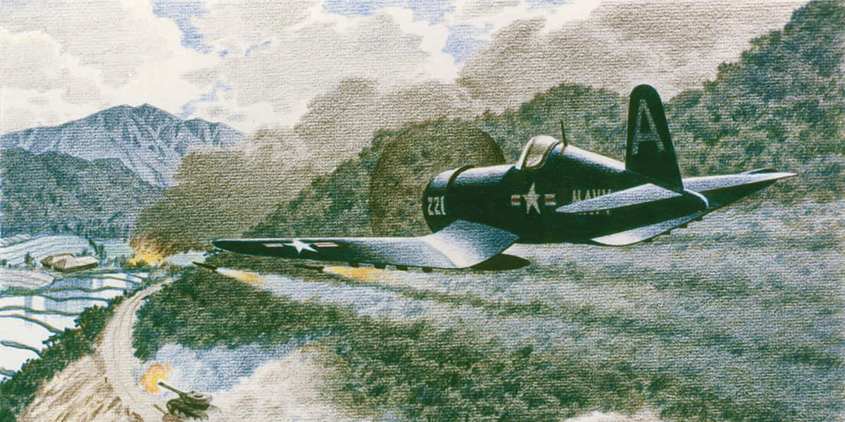 復古海軍戰鬥機低空飛過山區梯田。