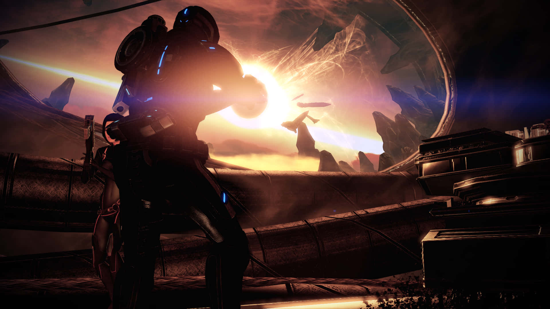Mass Effect Legendary Edition 桌布 壁紙 — 一個身穿發光盔甲的未來戰士，在一個有鋸齒狀岩石結構的外星行星上，以熾熱的日落為背景形成剪影。