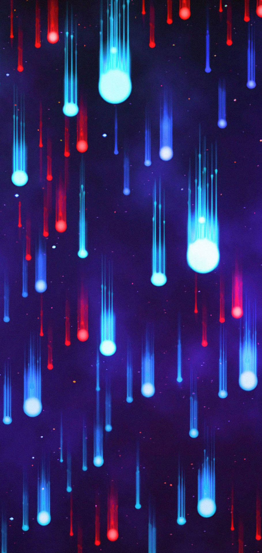 劃過的紅色和藍色流星穿過星空紫色天空落下。
