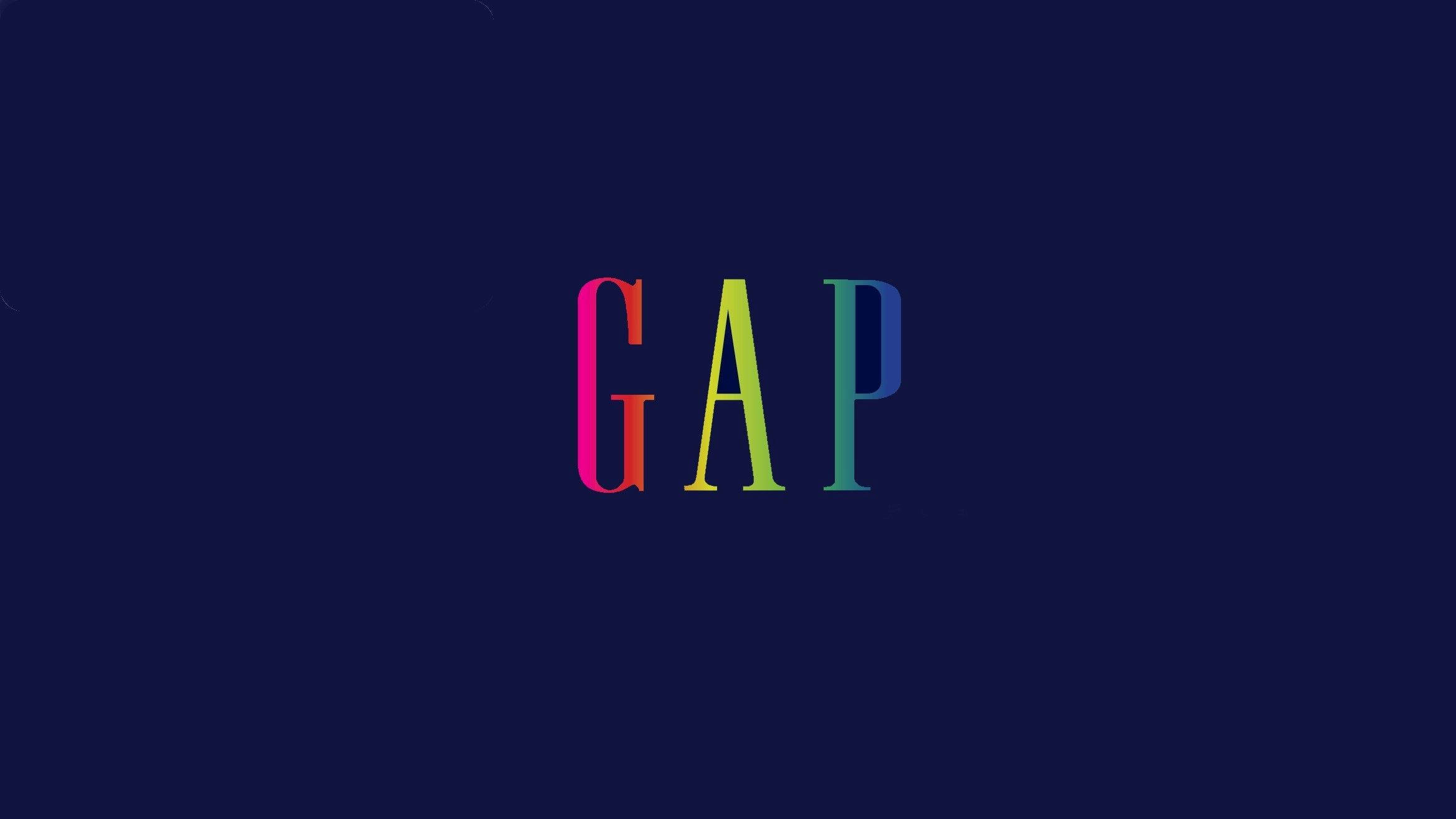 Gap 標誌漸層色彩 壁紙 — 單詞 GAP 以彩虹漸變字母居中於深海軍藍色背景上。