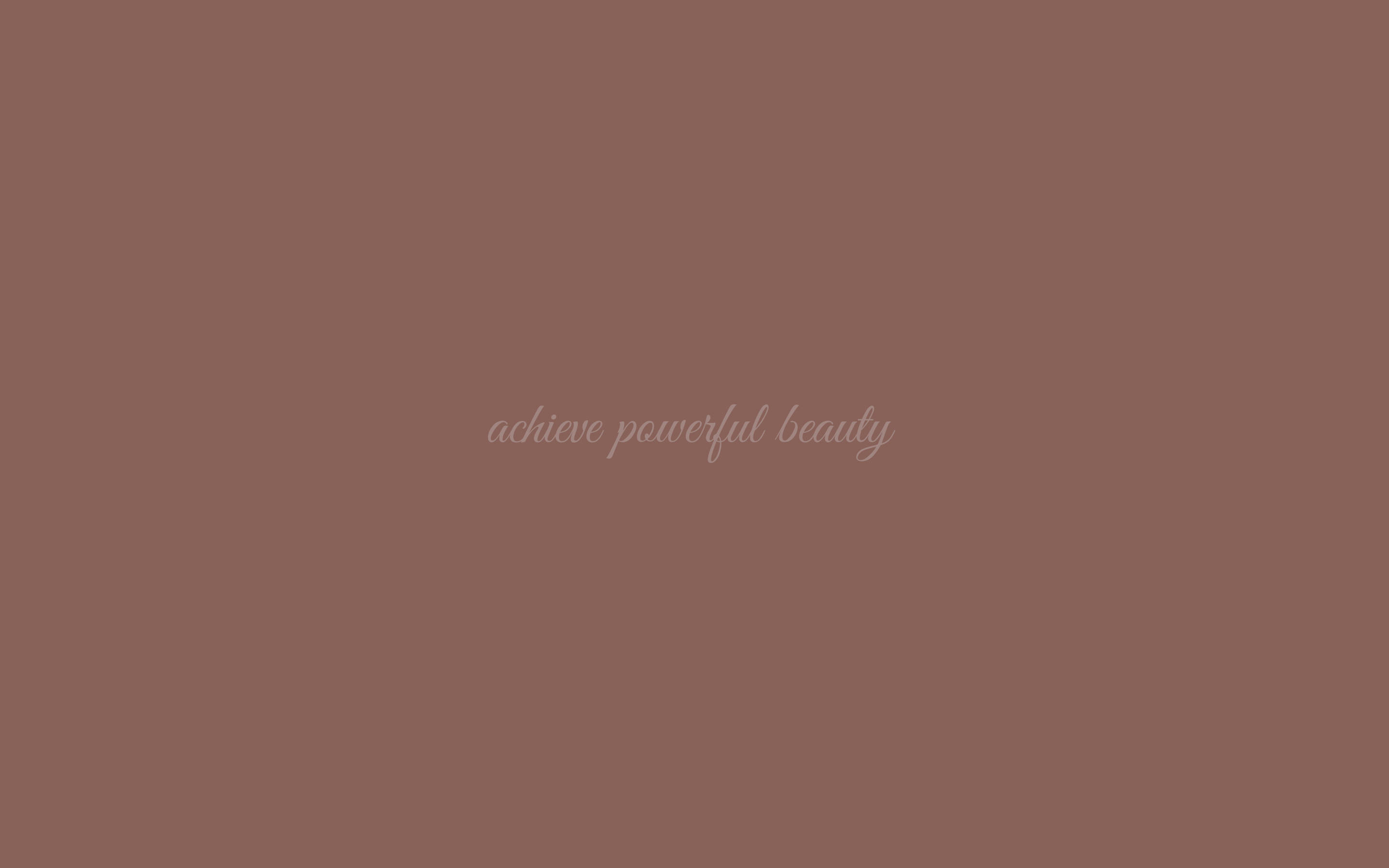 灰褐色背景，帶有模糊的草書文字寫著 achieve powerful beauty