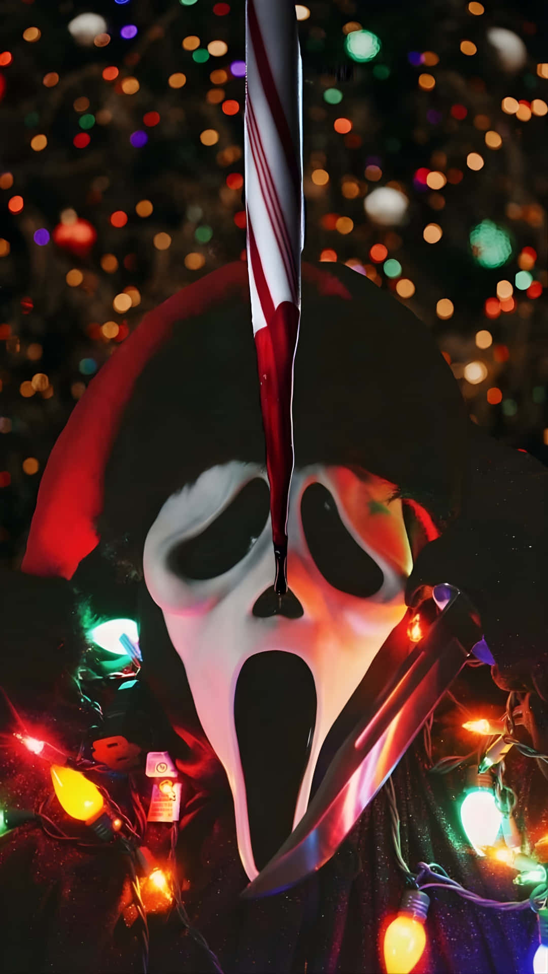  壁紙 — 《奪命狂呼》的Ghostface面具手持拐杖糖，背景是色彩繽紛的聖誕燈飾。