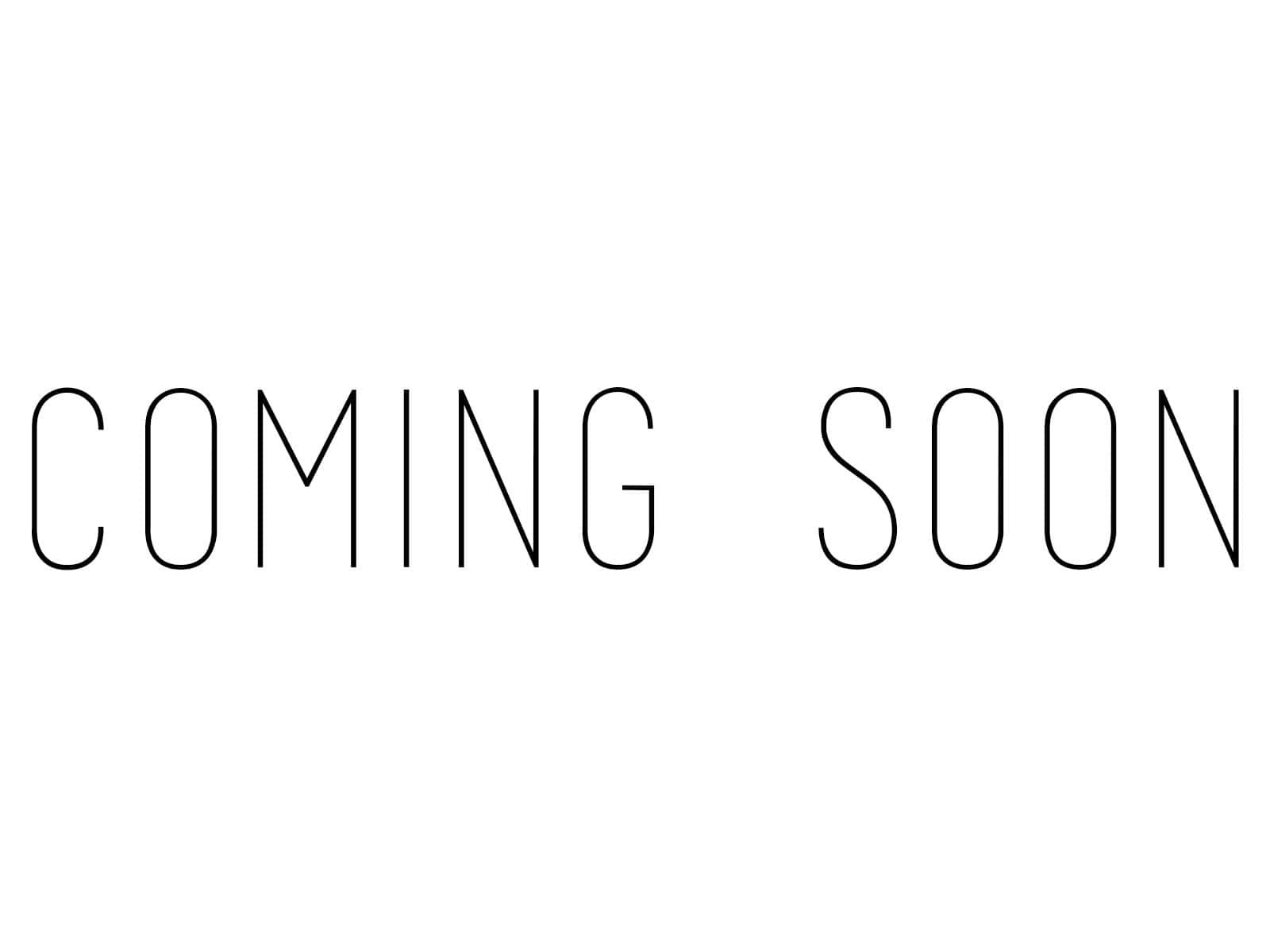 白色背景上帶有幼黑色輪廓的Coming Soon文字