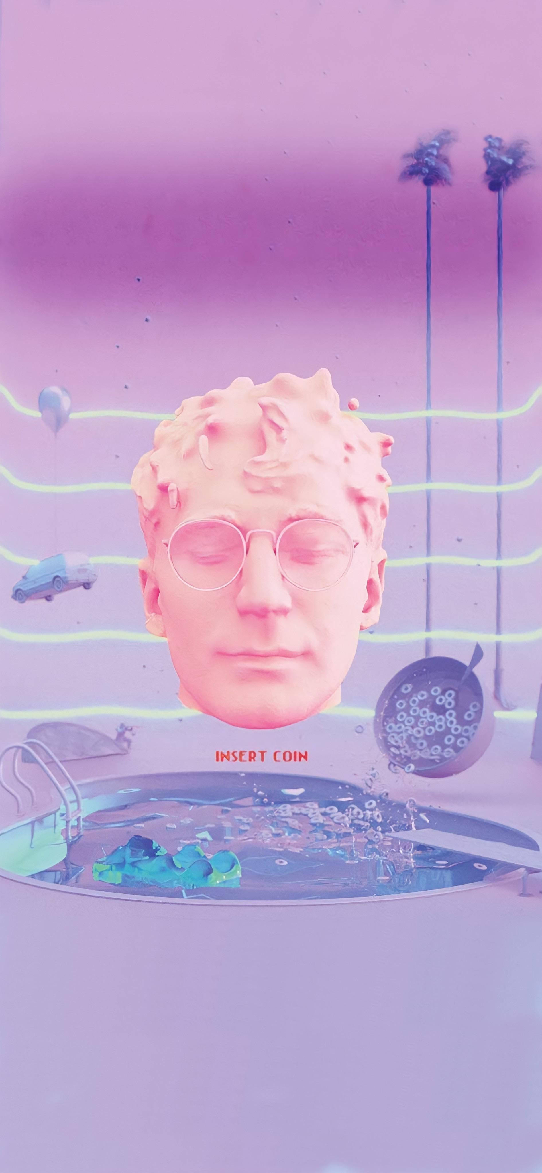 Glass Animals Aesthetics 壁紙 — 一個超現實的粉紅色場景，泳池上方有一個漂浮的頭部，帶有「INSERT COIN」文字以及漂浮的汽車和棕櫚樹。
