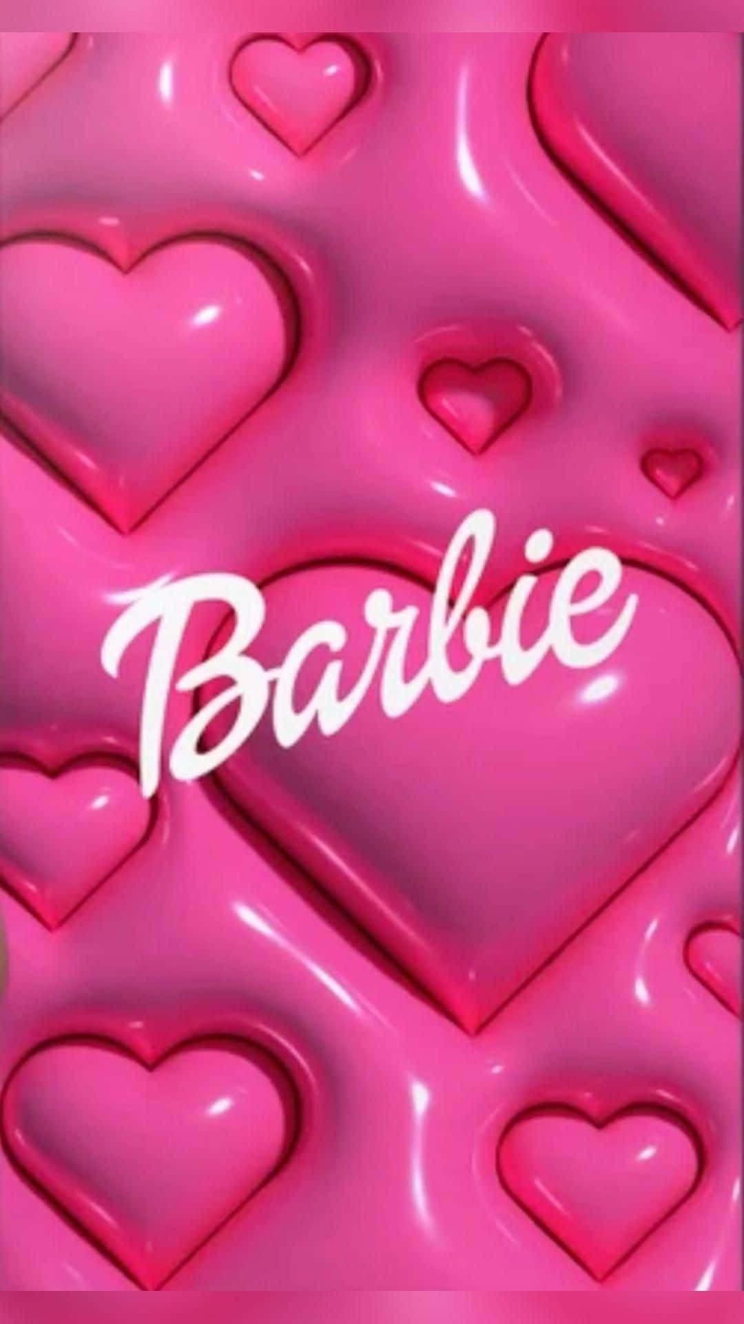 帶有白色草書「Barbie」文字的光澤粉紅色心形圖案。 — 粉紅色心形動圖 壁紙
