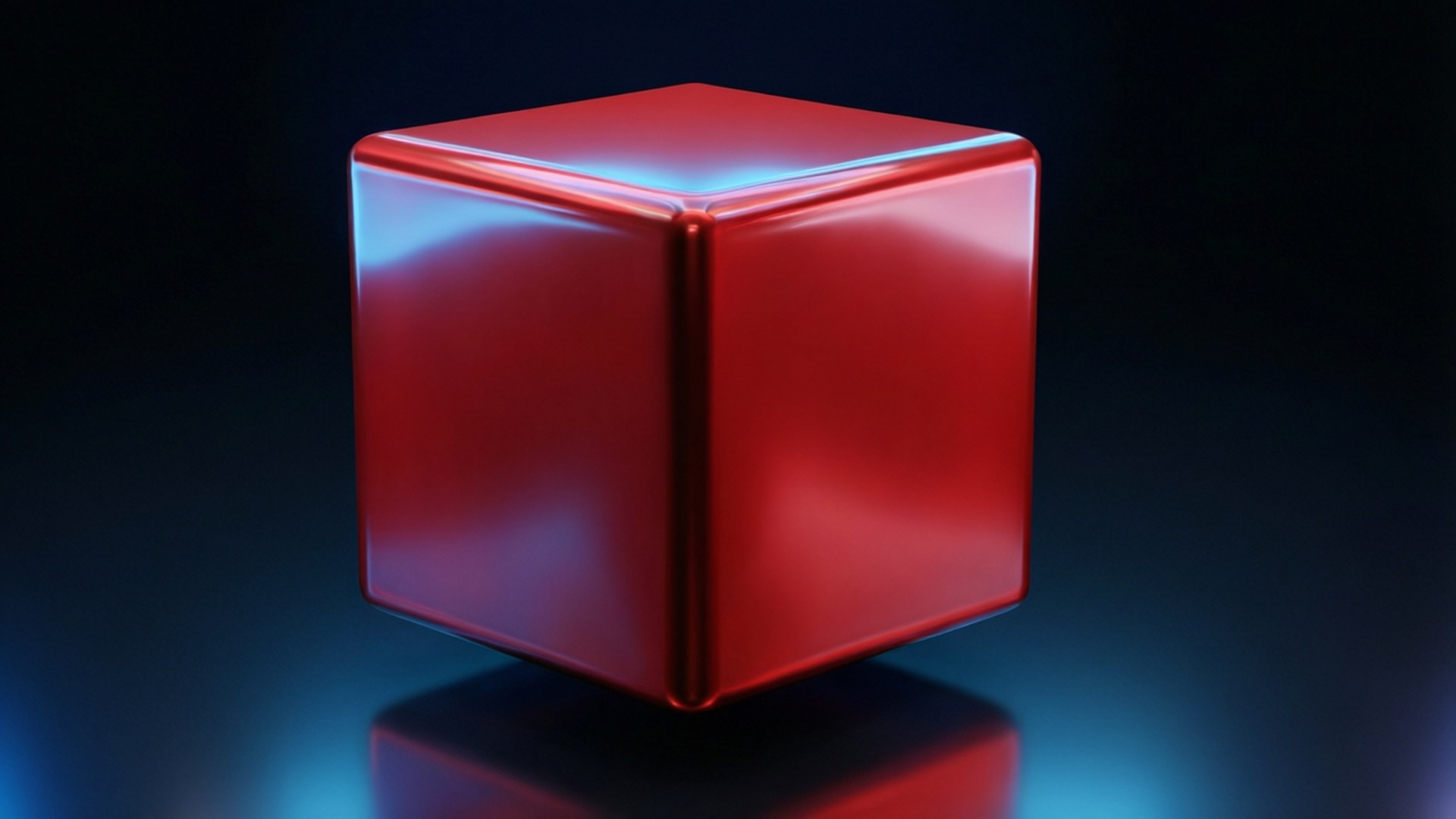 Glossy Red Cube 壁紙 — 一個帶有藍色高光的亮面紅色立方體，在攝影棚燈光下居中放置在反光的深色表面上。