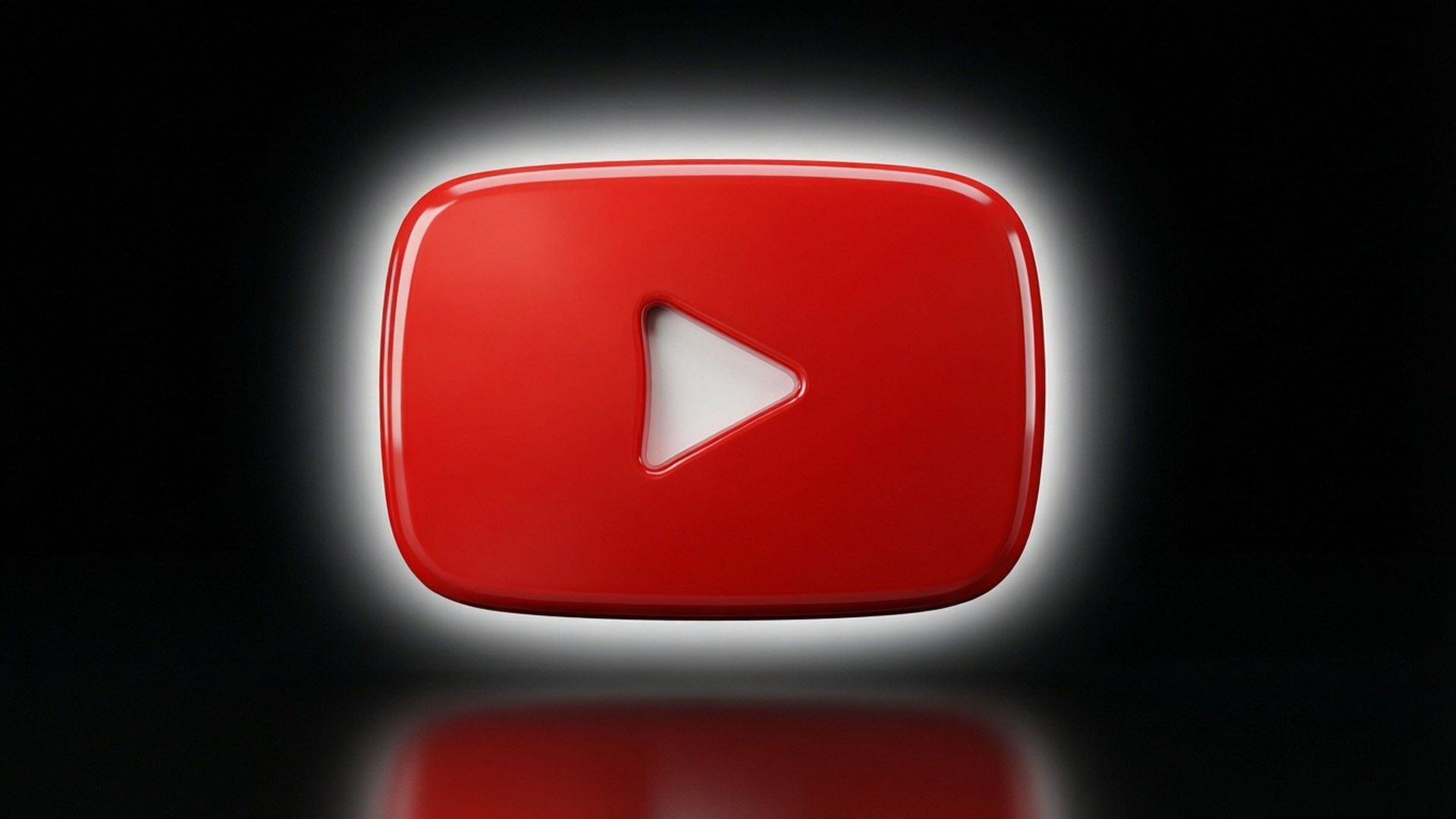 光澤的紅色 YouTube 播放按鈕圖標，白色中心在黑色背景上發光