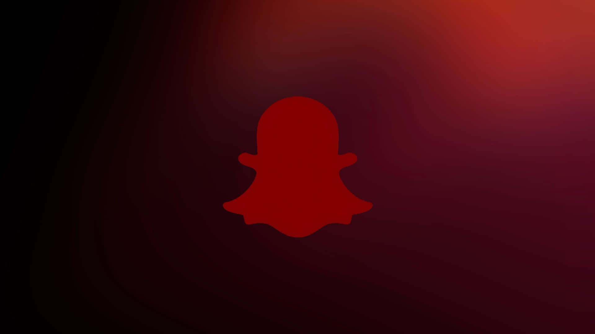  壁紙 — 一個發光的紅色Snapchat鬼魂標誌，居中於帶有溫暖紅色調的深色漸變背景上。