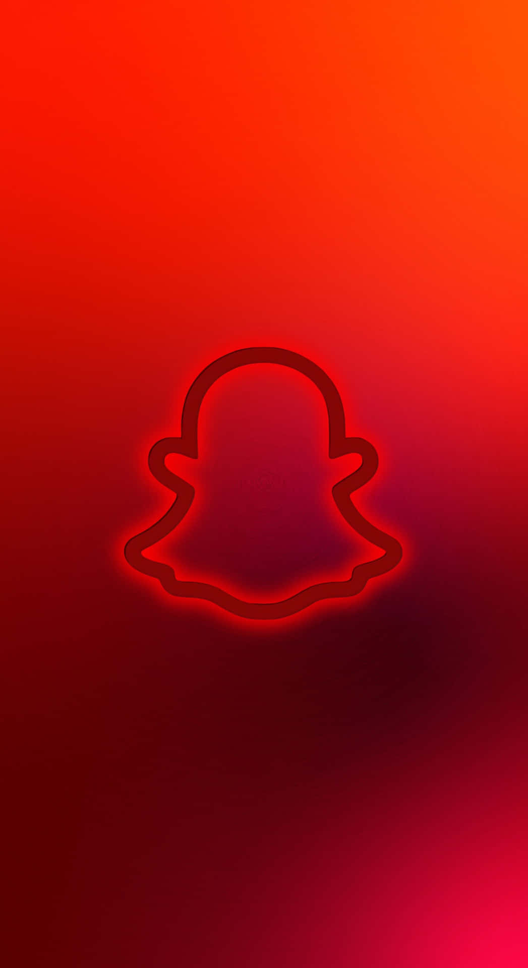  壁紙 — 在漸變紅色背景上居中放置的發光紅色Snapchat鬼魂標誌。