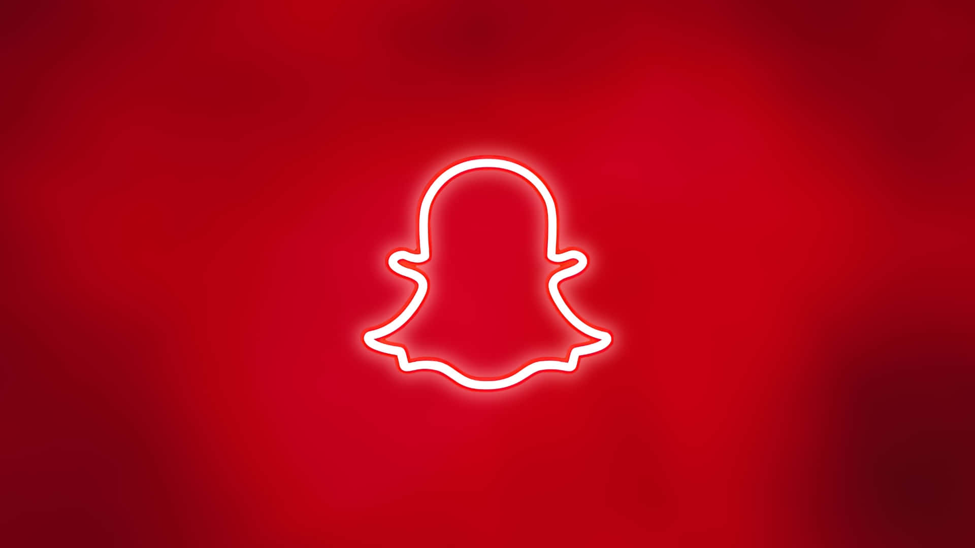 壁紙 — 發光白色霓虹Snapchat鬼魂標誌，居中於鮮豔漸變紅色背景上。