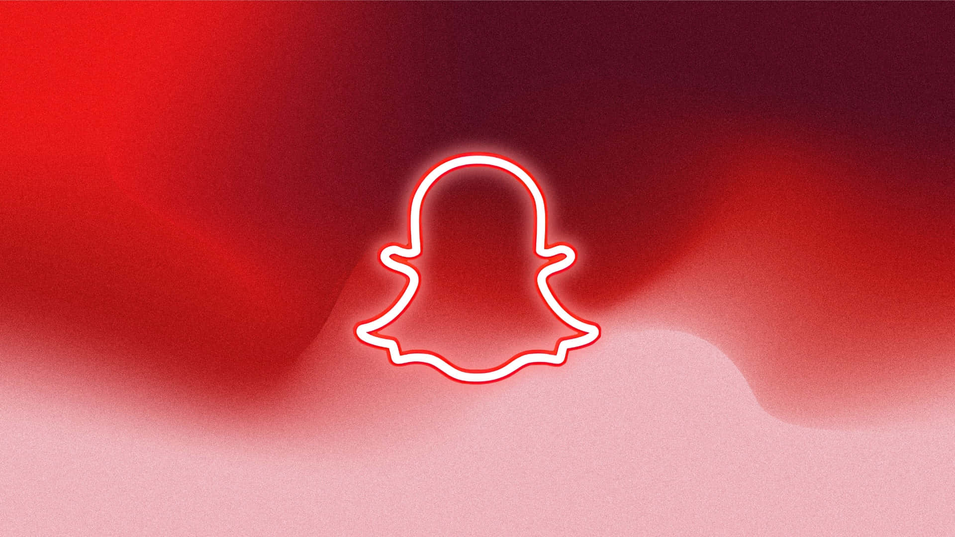  壁紙 — 發光白色霓虹燈Snapchat鬼魂標誌輪廓，居中於漸變紅色和粉紅色背景上。