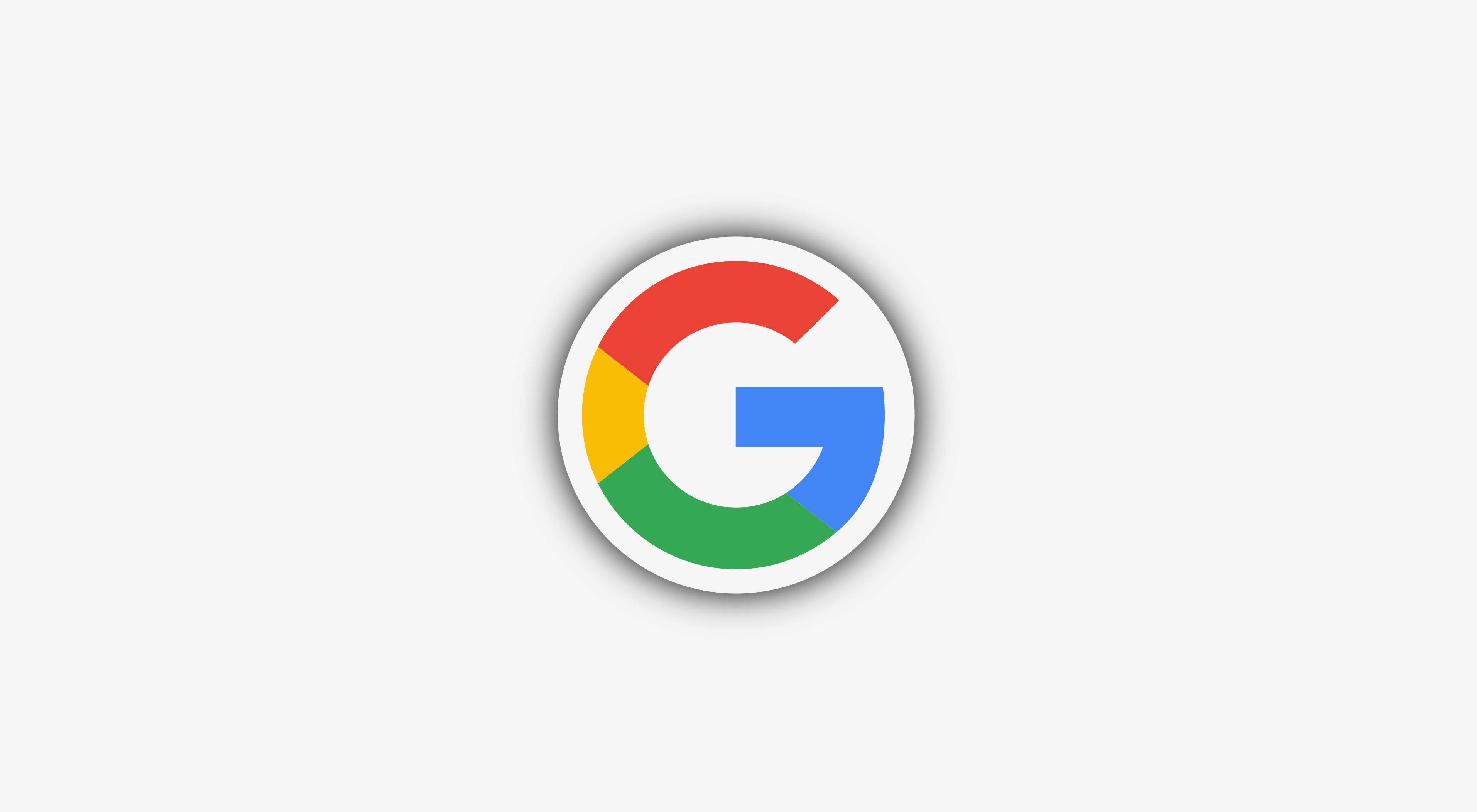 Gmail Google 標誌 壁紙 — Google 標誌圖示，帶有紅色、黃色、綠色和藍色部分，背景為淺灰色。