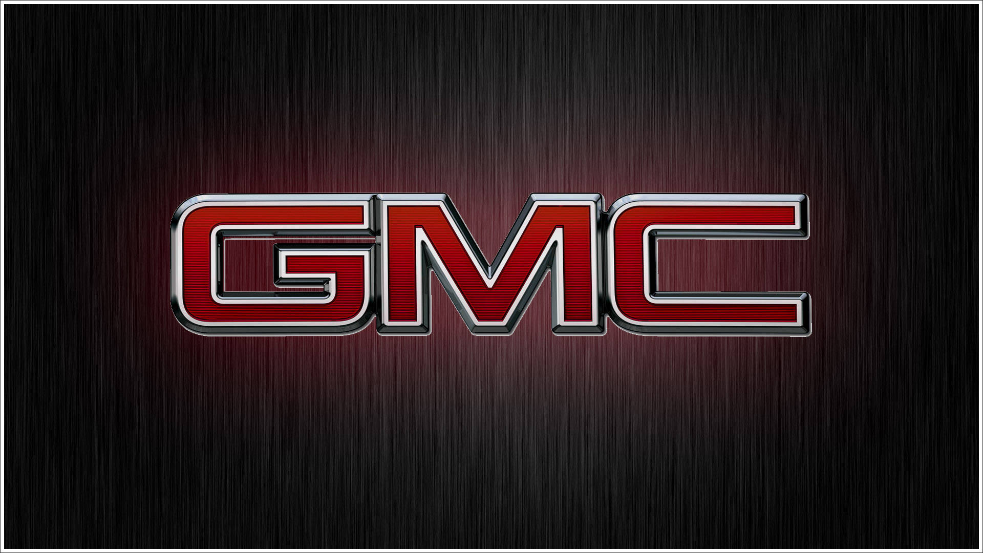 GMC 公司數位海報 壁紙 — GMC 標誌以粗體紅色鍍鉻字母居中顯示在帶有漸變照明的深色拉絲金屬背景上。