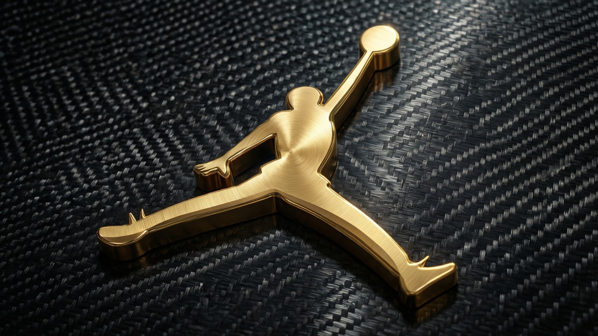 金色 Jumpman 標誌在黑色碳纖維背景上