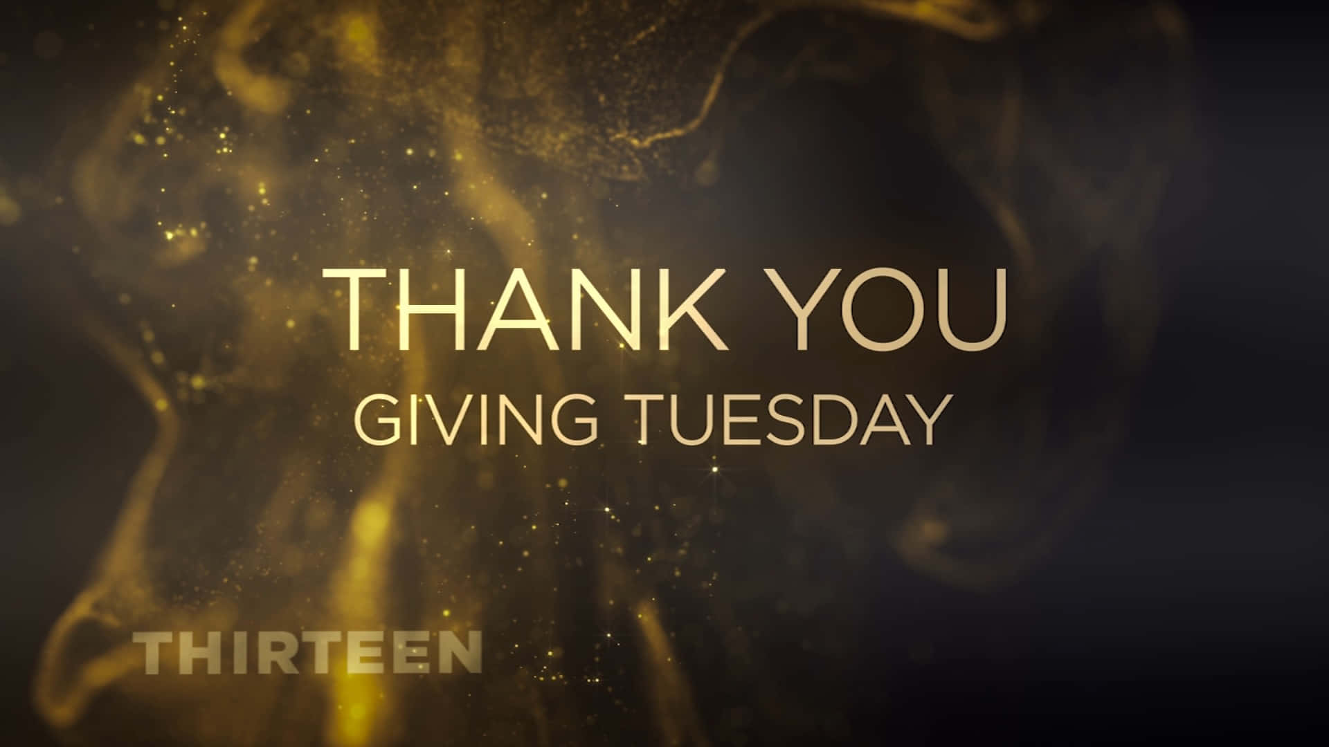  壁紙 — 金色粒子在深色背景上圍繞粗體文字「THANK YOU GIVING TUESDAY」旋轉。