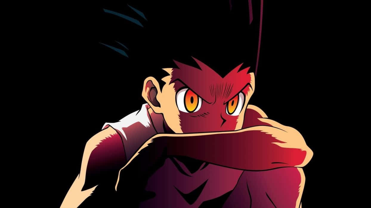 Gon Freecss，準備迎接下一個挑戰 壁紙 — 一個兇猛的動漫男孩，擁有發光的橙色眼睛和紅色臉龐，在黑色背景下強烈凝視。