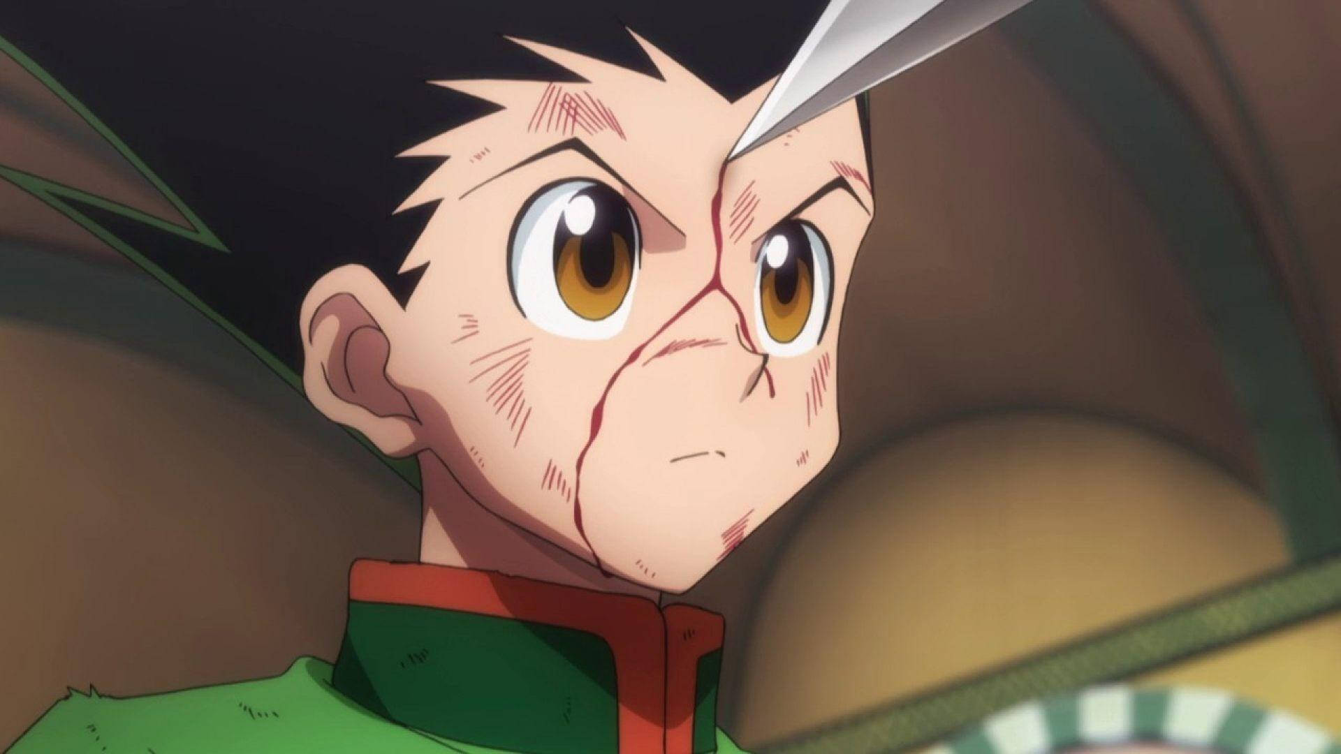 動畫男孩臉上帶血，刀刃壓在額頭上。