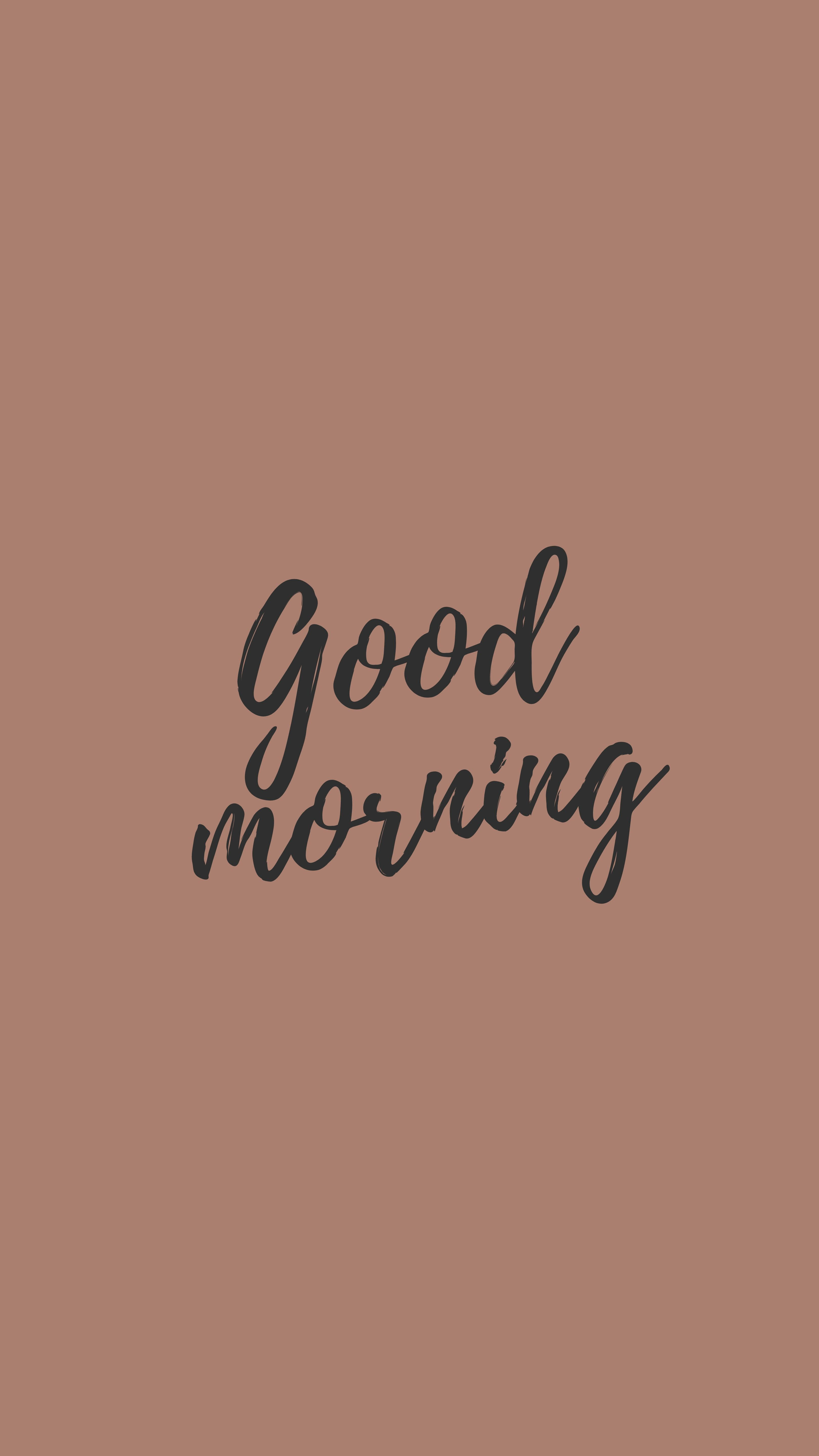 以「Good Morning」開啟美好一天 壁紙 — 一個簡約的棕色背景，中央有優雅的黑色草書文字寫著「早晨」，營造平靜的早晨問候。