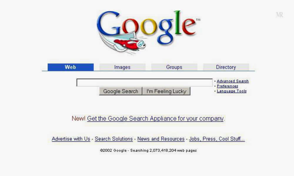 2002 年 Google 搜索引擎首頁，帶有火箭標誌和搜索欄。
