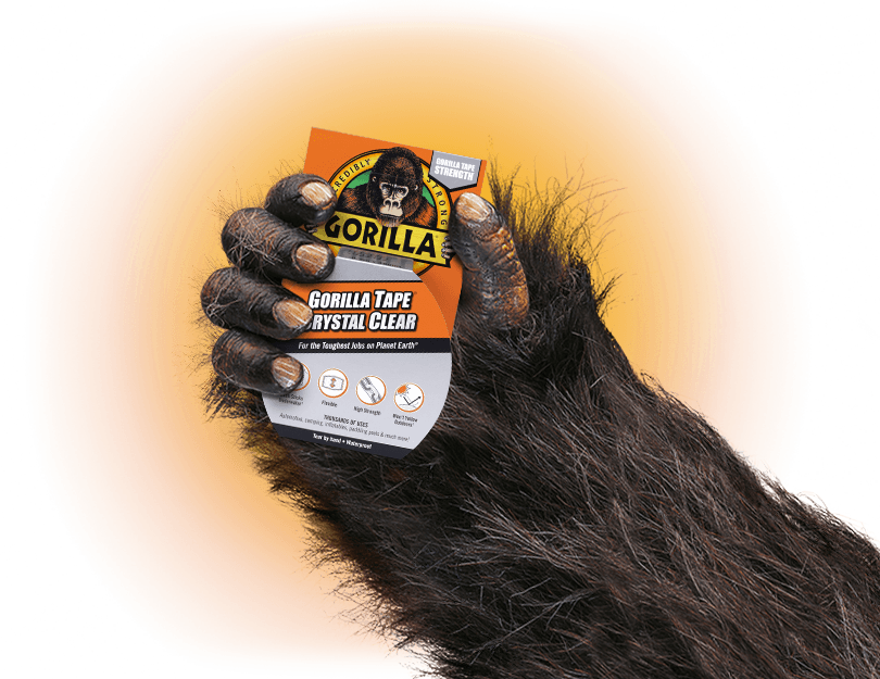 Gorilla Tape 水晶透明膠帶廣告 壁紙 — 一隻大猩猩手抓住一卷Gorilla Tape Crystal Clear，背景是鮮豔的橙色和藍綠色。