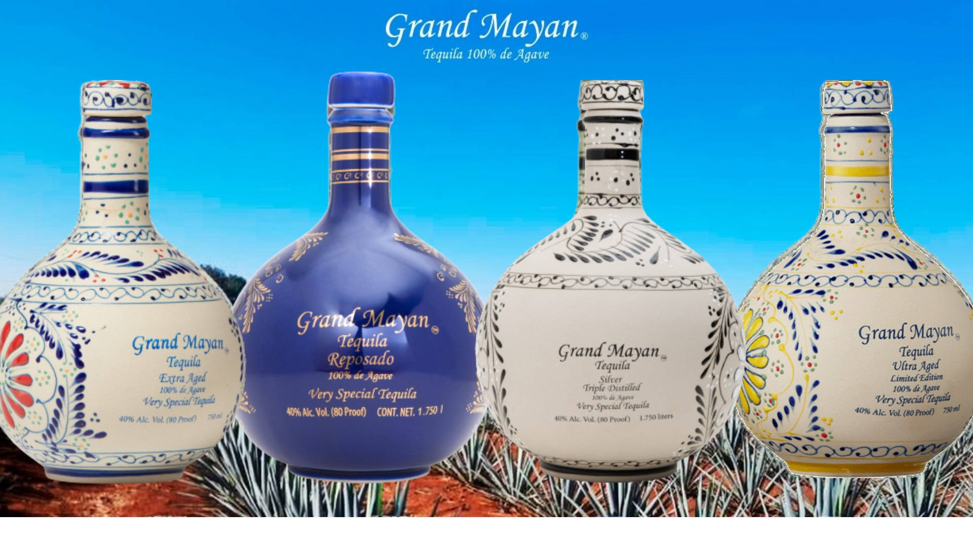 四瓶色彩繽紛設計的Grand Mayan龍舌蘭酒瓶在戶外展示。