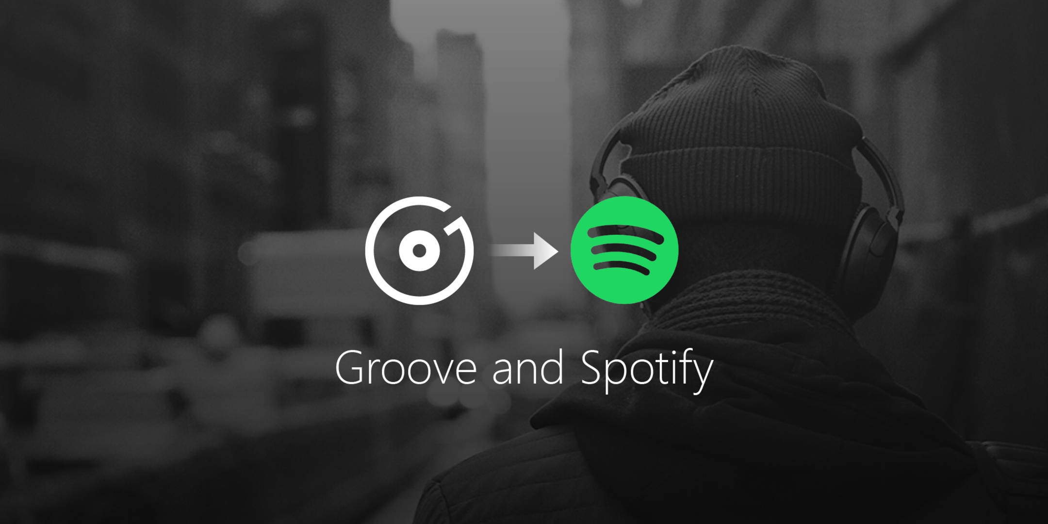 Groove 與 Spotify 壁紙 — 一個人戴著耳機沿著城市街道走開，同時出現從 Groove 到 Spotify 的標誌過渡。