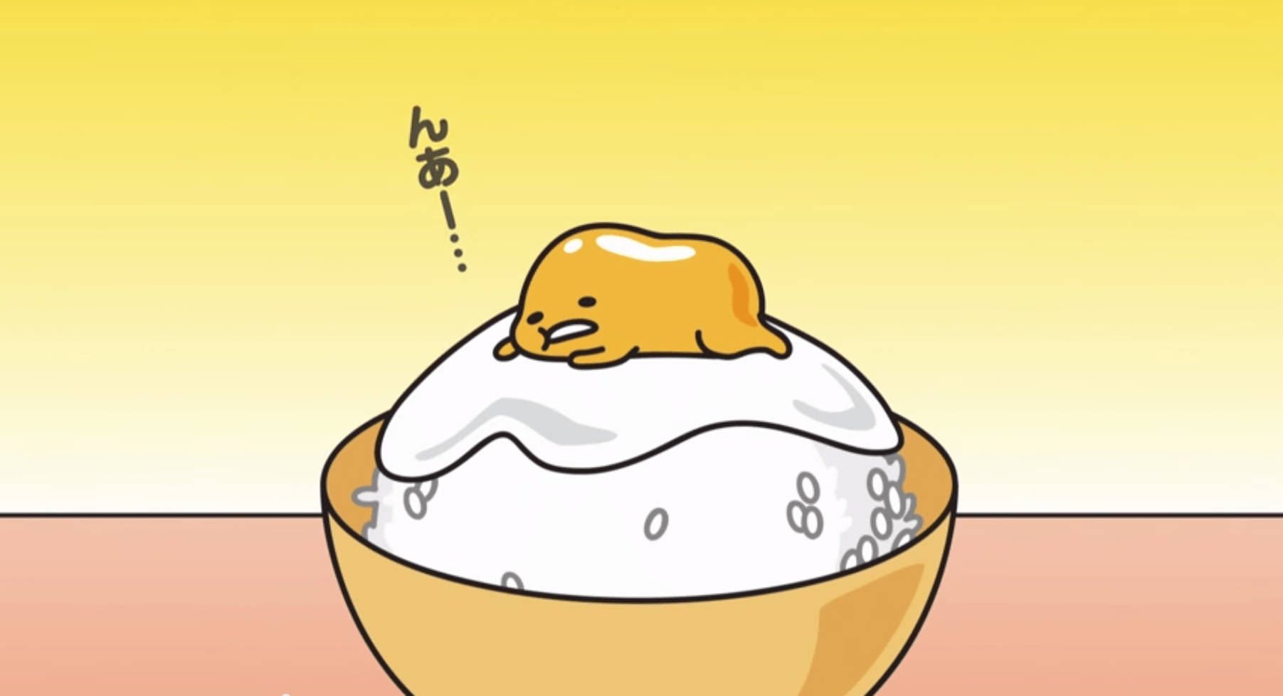一個卡通軟糖角色帶著開心的表情在飯碗上休息。